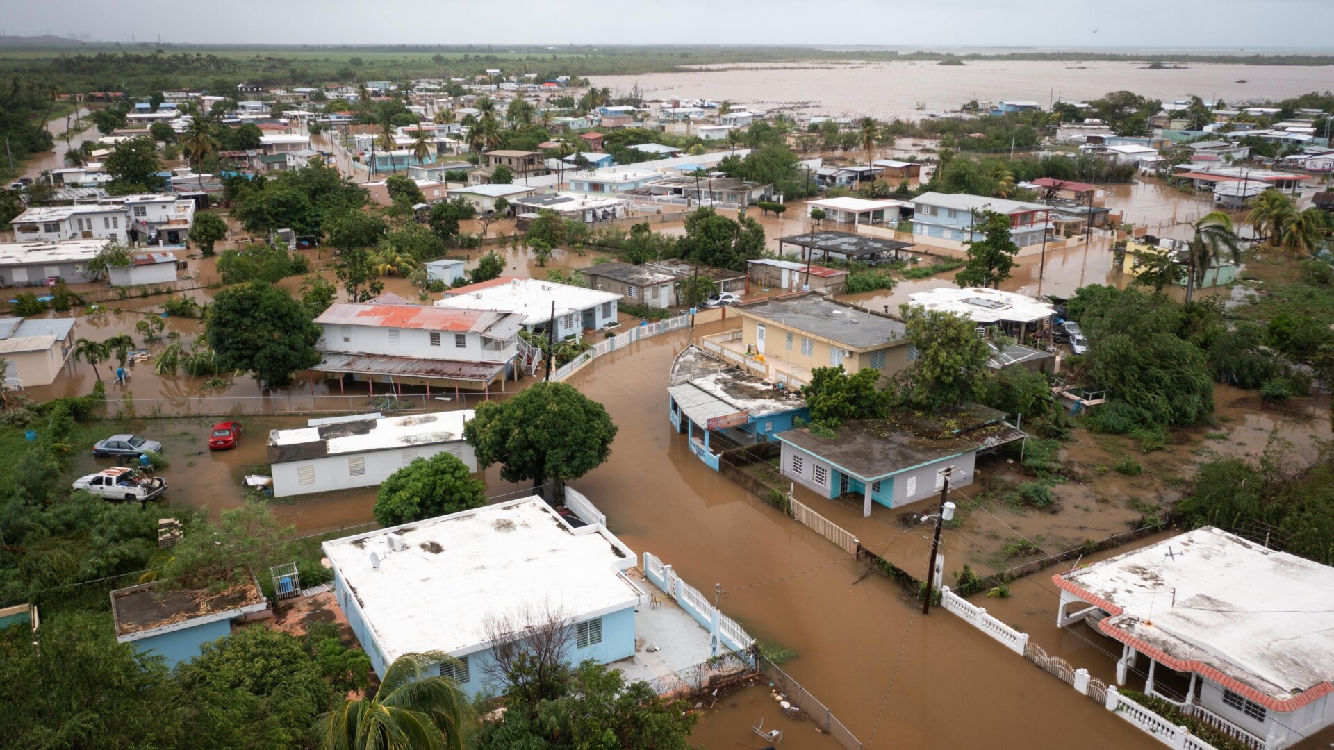 Homes and businesses in Salinas, Puerto Rico remained under flood waters on Monday afternoon.