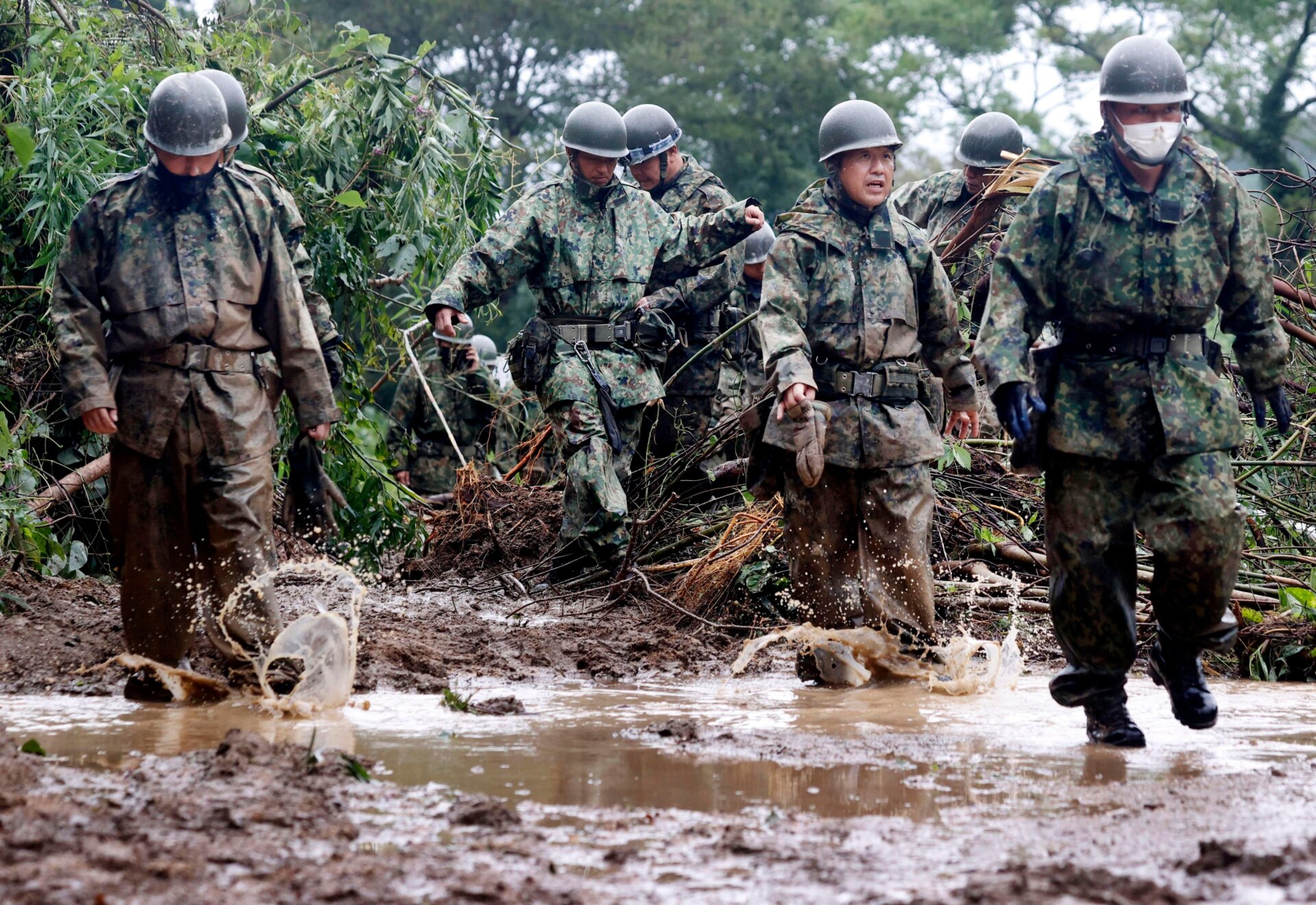 Japanese forces search for the man missing in a mudslide in Mimata on September 19.