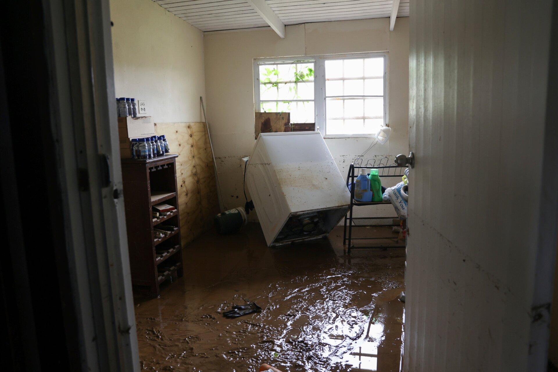 Mud covers the floor of a house flooded by Fiona in Cayey, Puerto Rico. 
