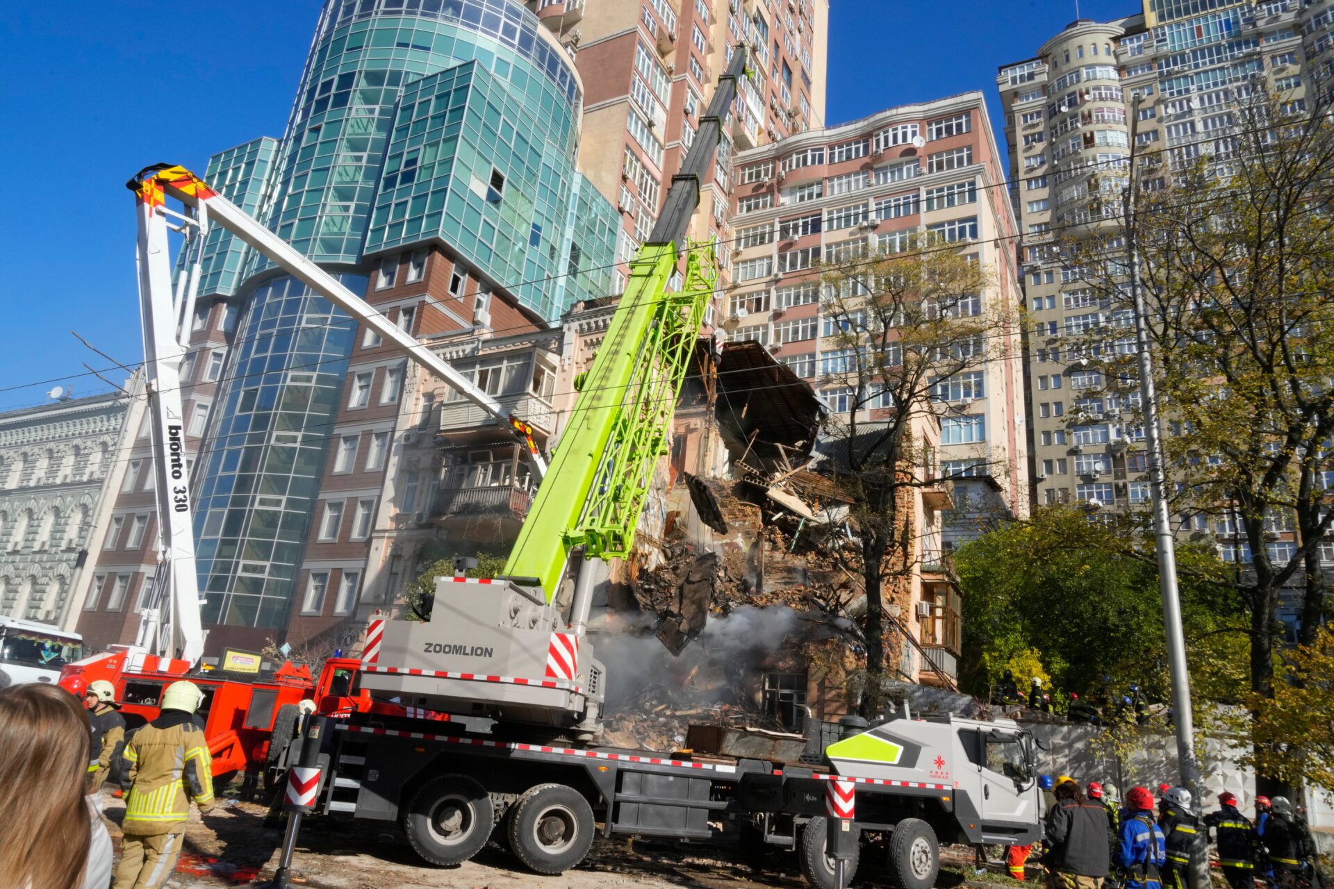 Firefighters work after a drone hit buildings in Kyiv, Ukraine on Monday, Oct. 17, 2022.