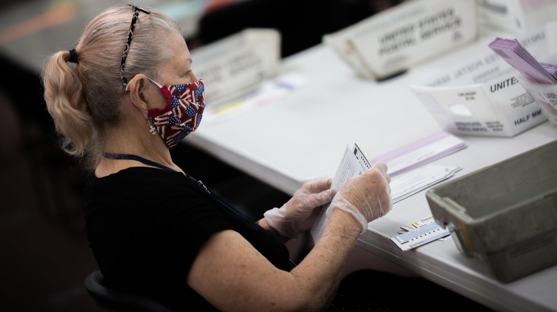 A Nevada poll worker during the 2020 primary election. Konnech and its CEO, Eugene Yu, are accused of mismanaging data on poll workers. The software company has contracts with multiple U.S. counties that use its services to schedule and manage election workers. Critically, none of the data in question relates to votes, voters, or election outcomes.