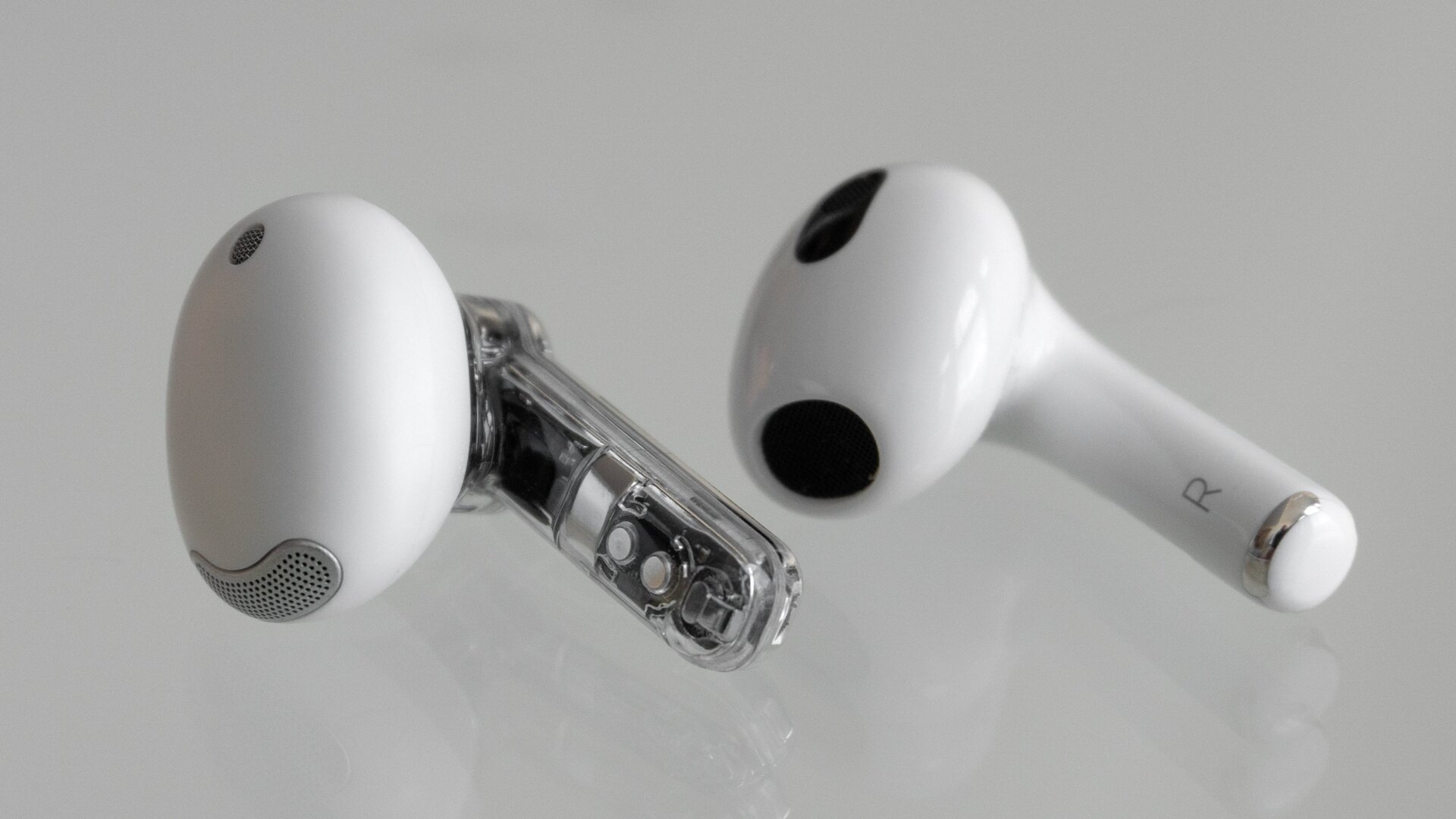 The Ear (stick) (left) compared to the third-gen AirPod (right) which are more or less identical in size.