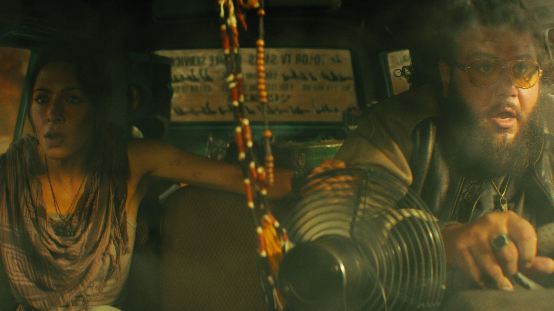 Adrianna Tomaz (Sarah Shahi) along with her brother Karim (Mohammed Amer)