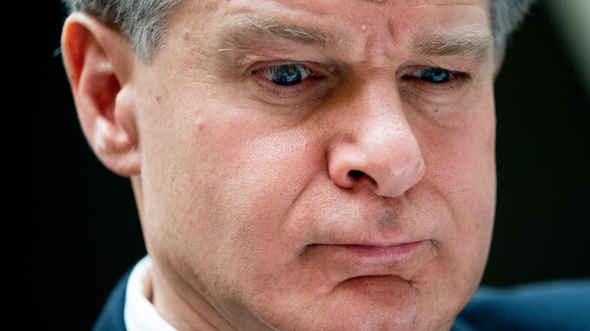 Chris Wray, director of the FBI, thinks about something during a House Intelligence Committee hearing. 