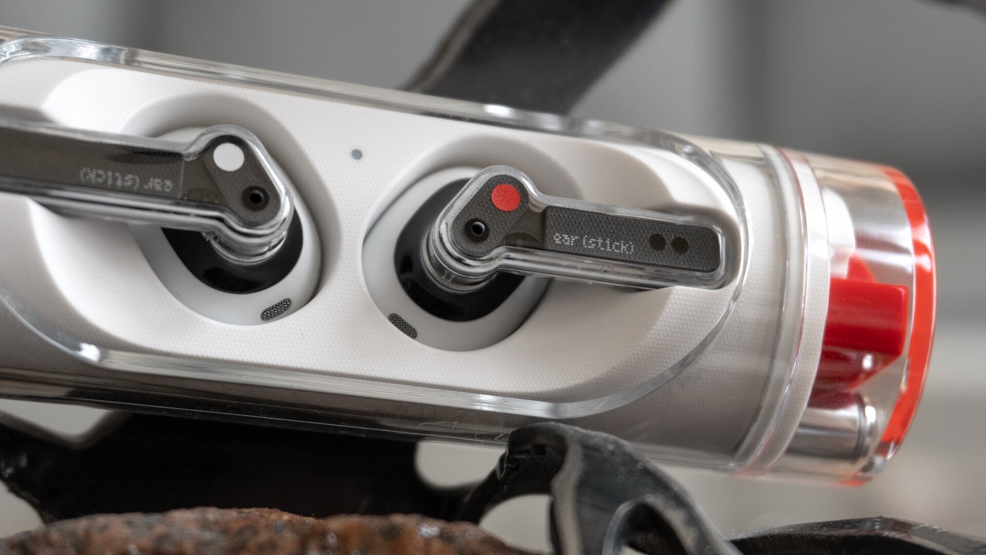 The Ear (stick) carry forward the see-through plastic aesthetic of the original Ear (1).