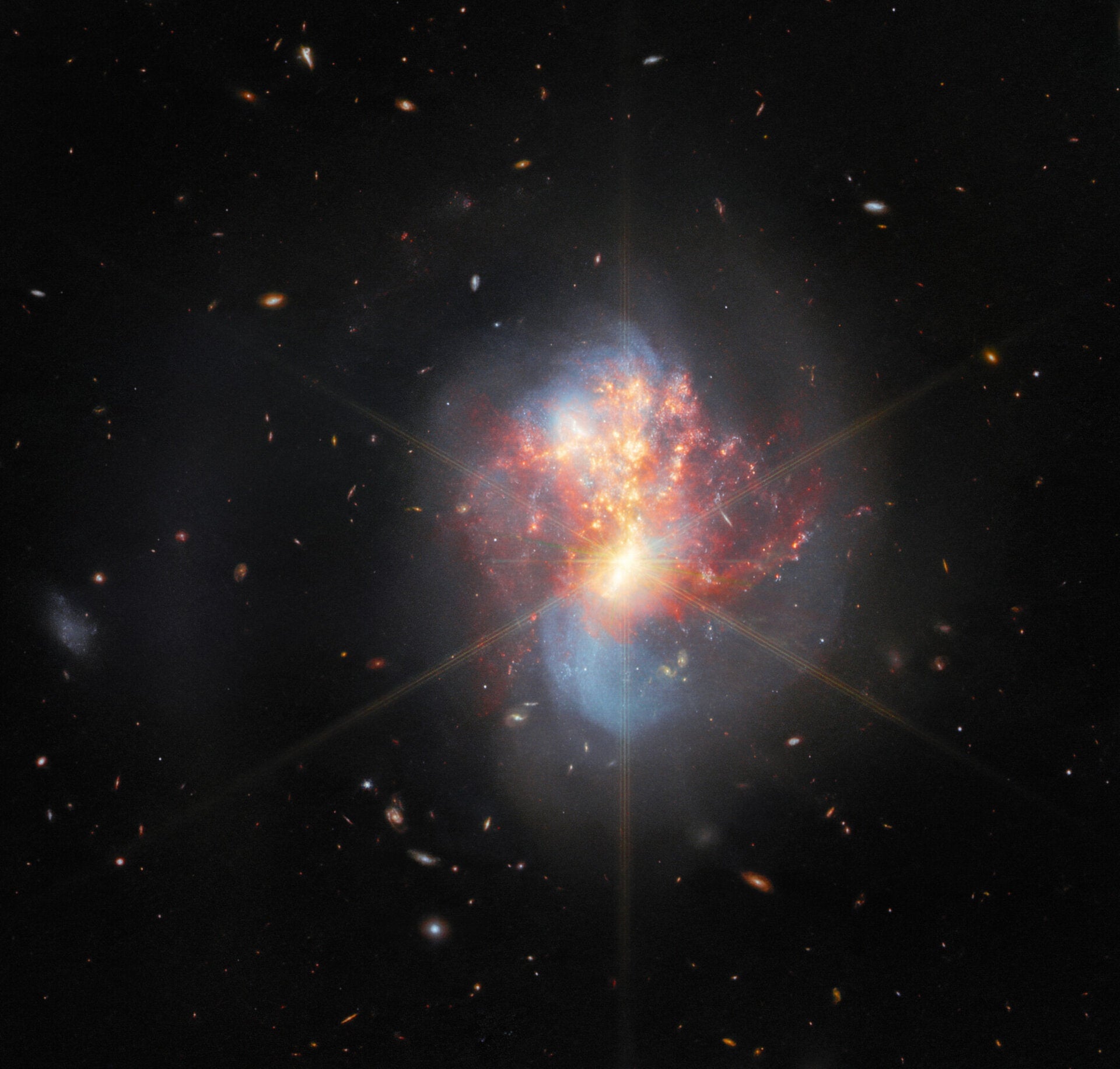 Webb’s image (in mid- and near-infrared light) cuts right through the dust, revealing more details.