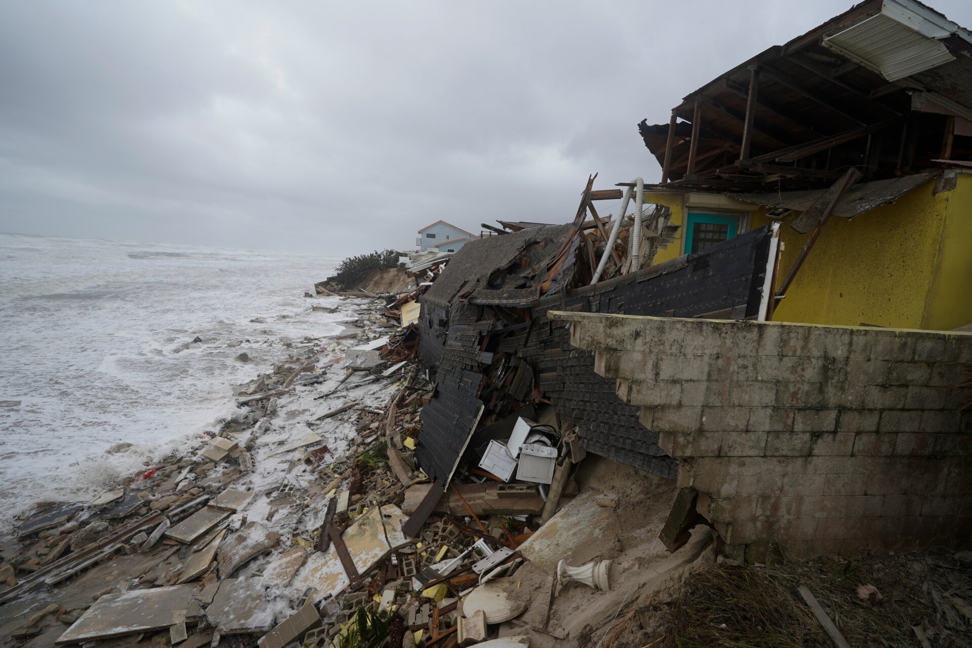 Damages and destroyed homes stretch along the entire beachfront in Wilbur-By-The-Sea