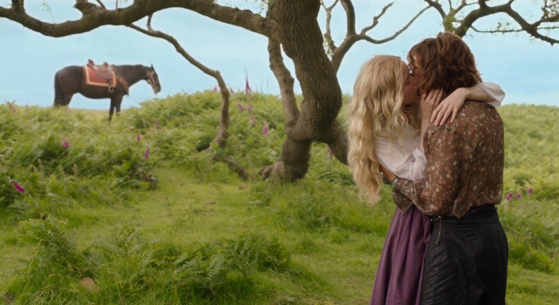 Airk and Dove standing under a tree, k-i-s-s-i-n-g.