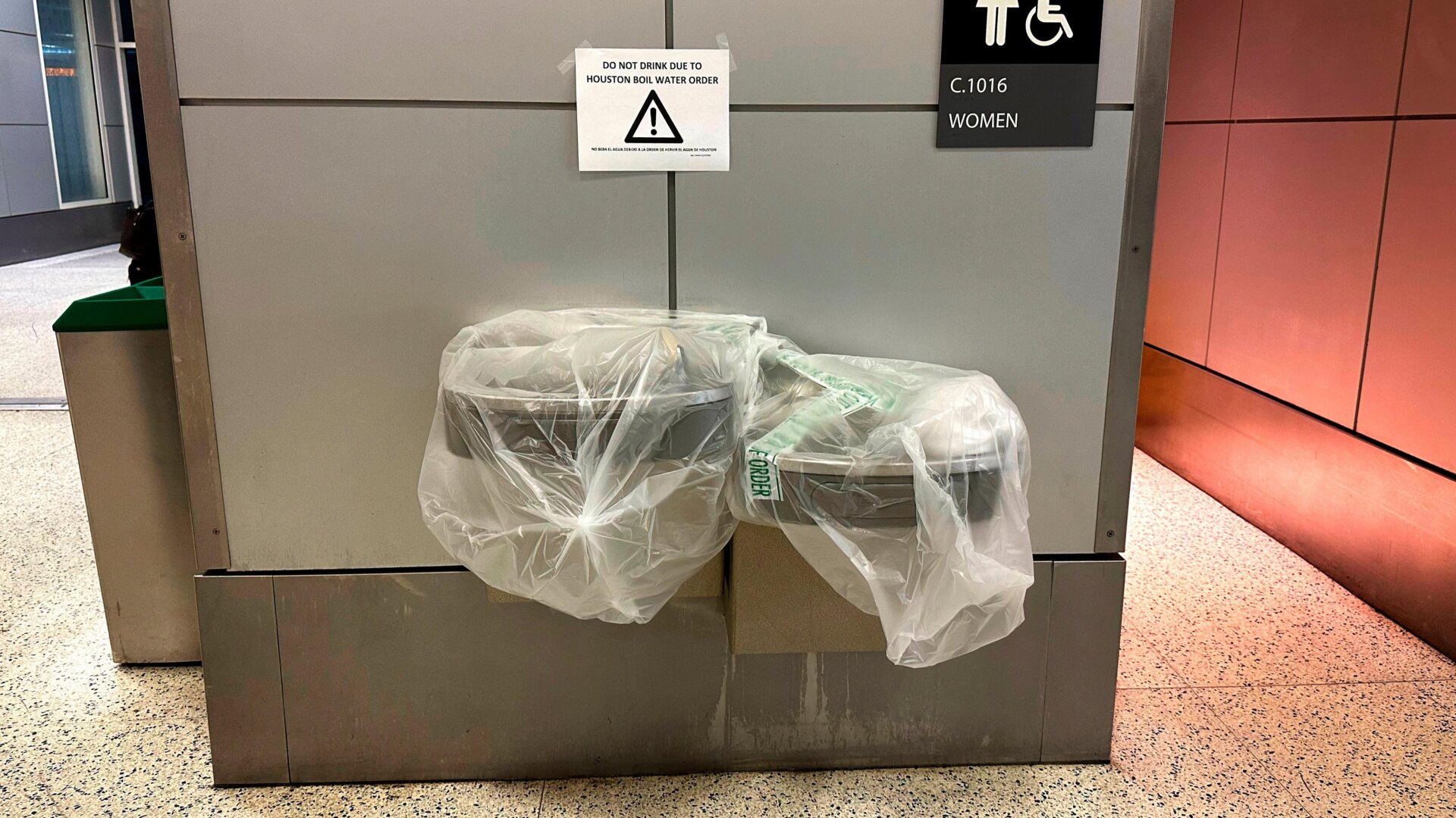 A warning sign reads “Do Not Drink Due To Houston Boil Water Order” above  a water fountain at George Bush Intercontinental Airport on Nov.  28, 2022 in Houston, Texas.