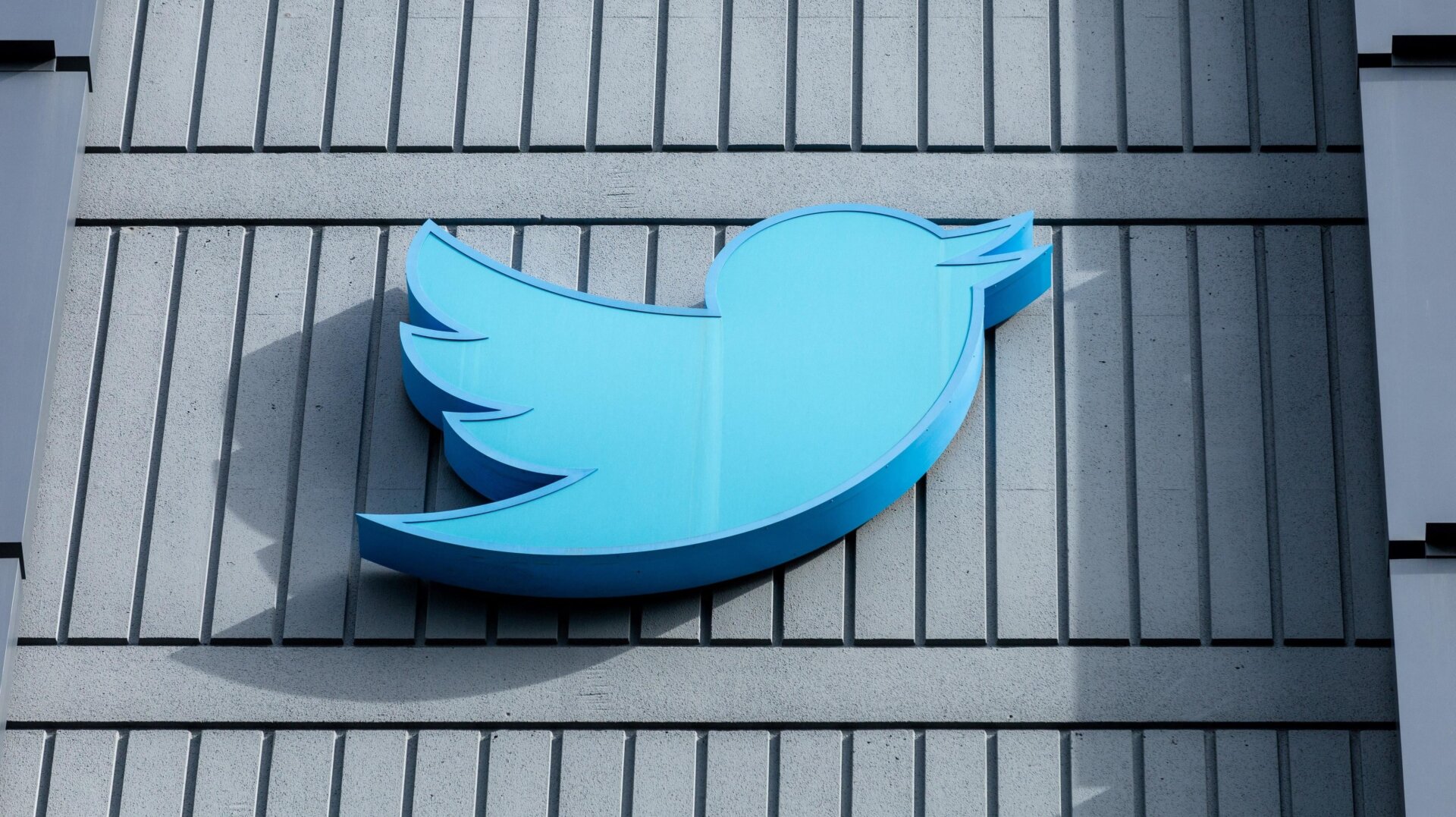 The Twitter logo is seen on a sign on the exterior of Twitter headquarters in San Francisco, California, on October 28, 2022.