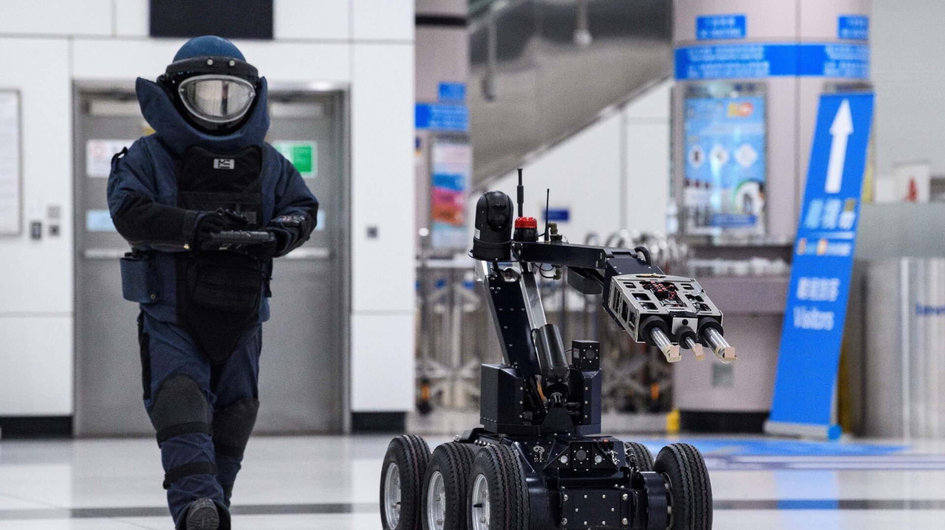 A Hong Kong police officer controls a bomb disposal robot in a counter-terrorism exercise in 2020.