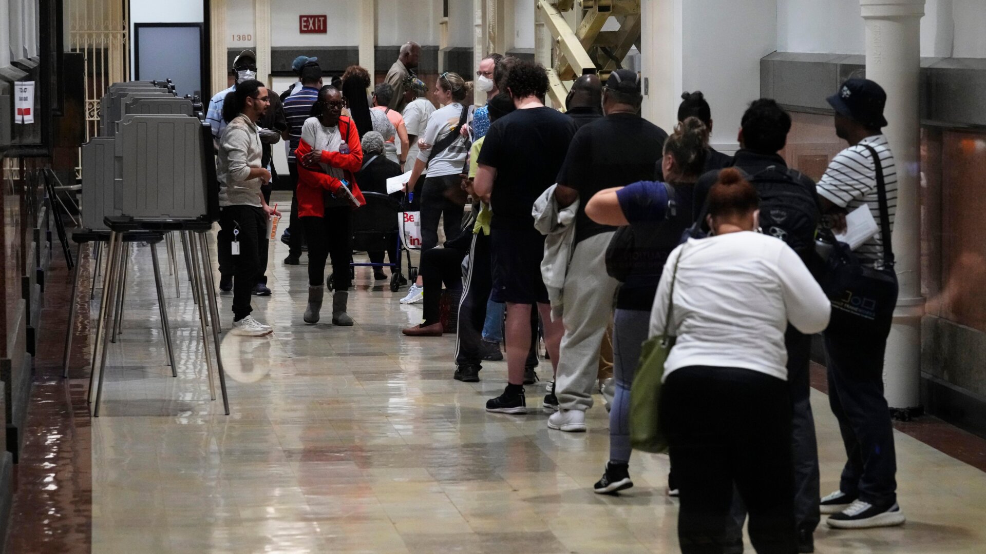 Voters wait in line to vote early during midterm elections in Philadelphia on Nov. 7.