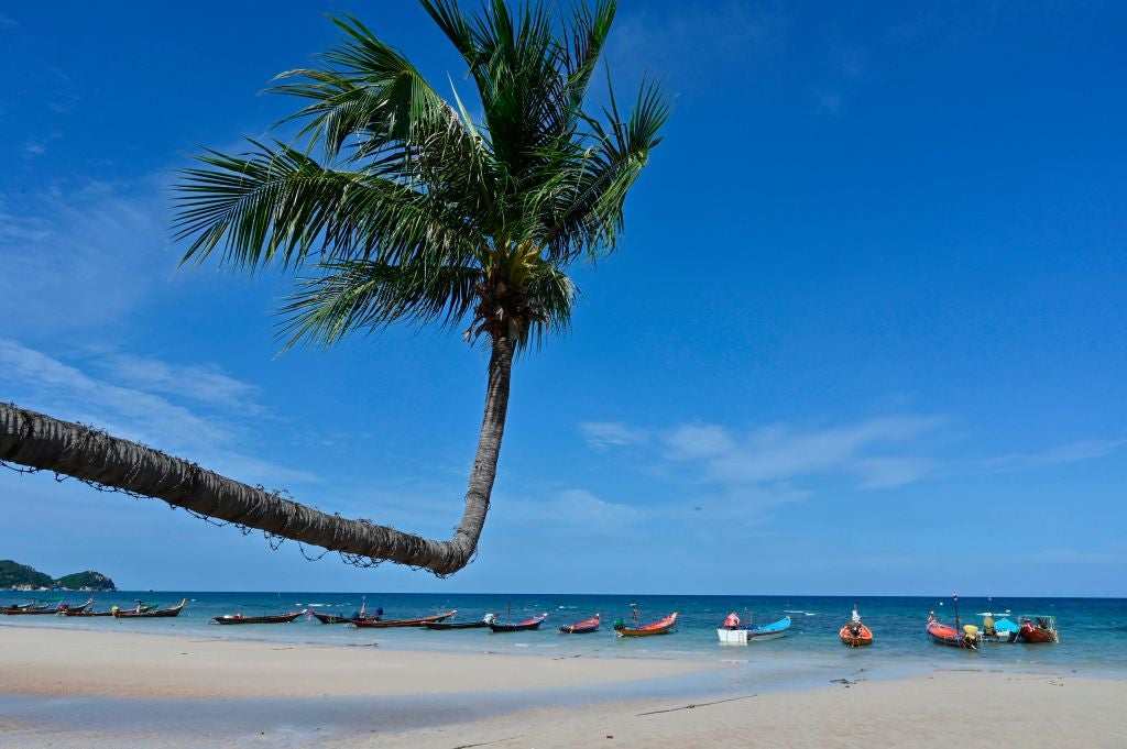In this photo taken on August 21, 2020 empty taxi boats are seen along the beach in Koh Tao island in the Gulf of Thailand.