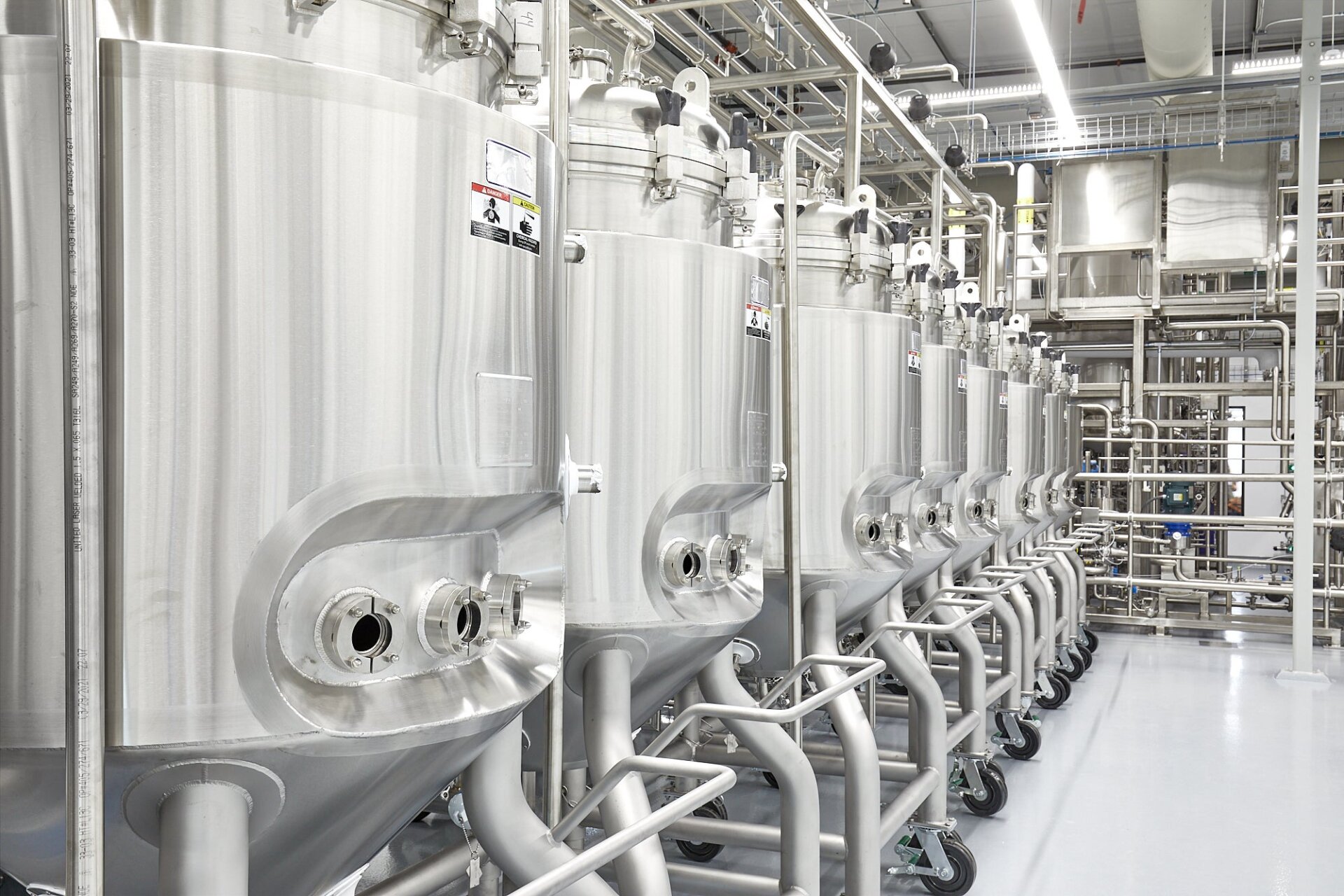 Cultured meat is typically grown in large vats, where a small amount of animal cells are fed with a medium or feed stock. 