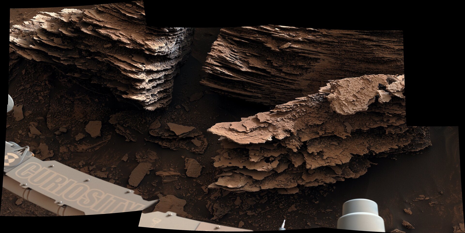 Curiosity’s view of layers of flaky rocks.