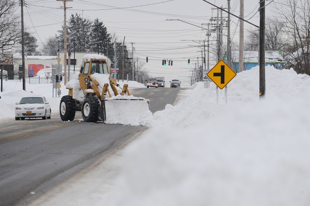 A loader clears snow on December 26, 2022 in West Seneca, New York. 