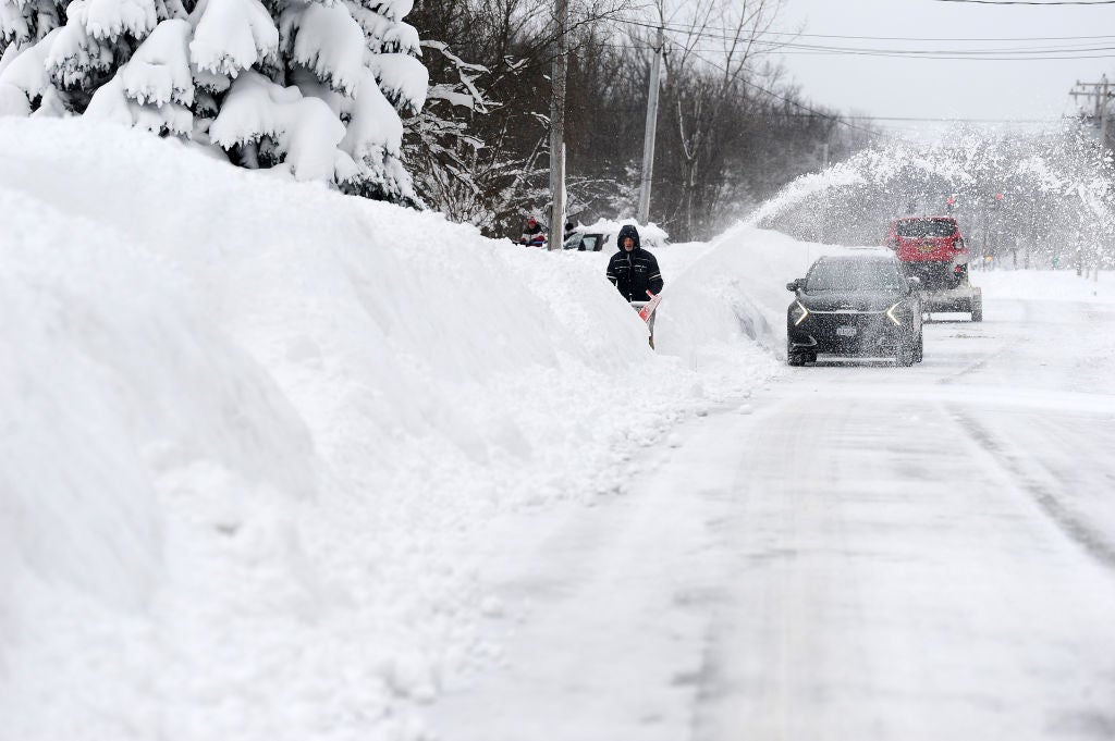 A man attempts to clear his driveway on December 26, 2022 in Hamburg, New York.