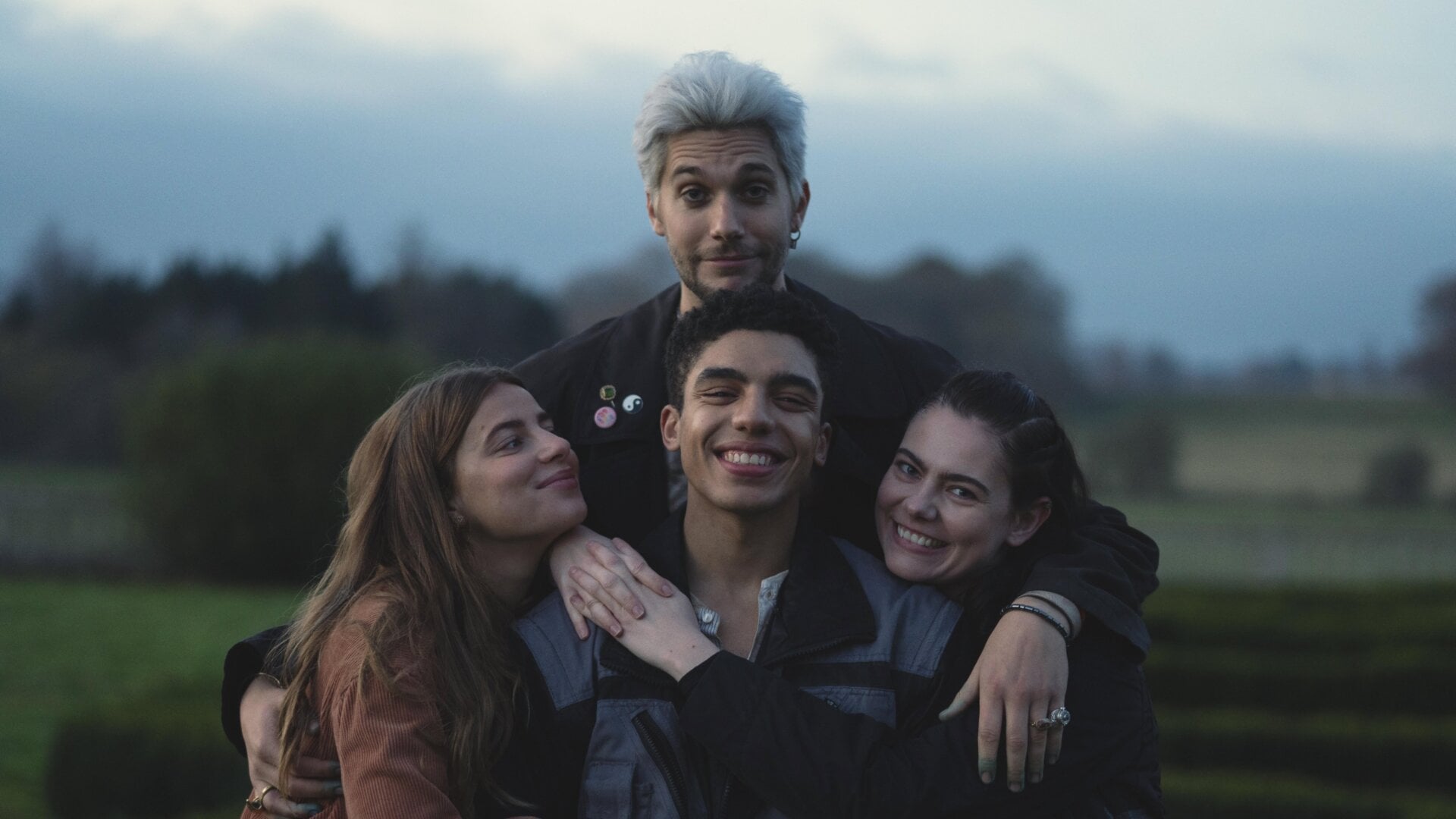 A BTS photo of the cast, all of whom I would die for.