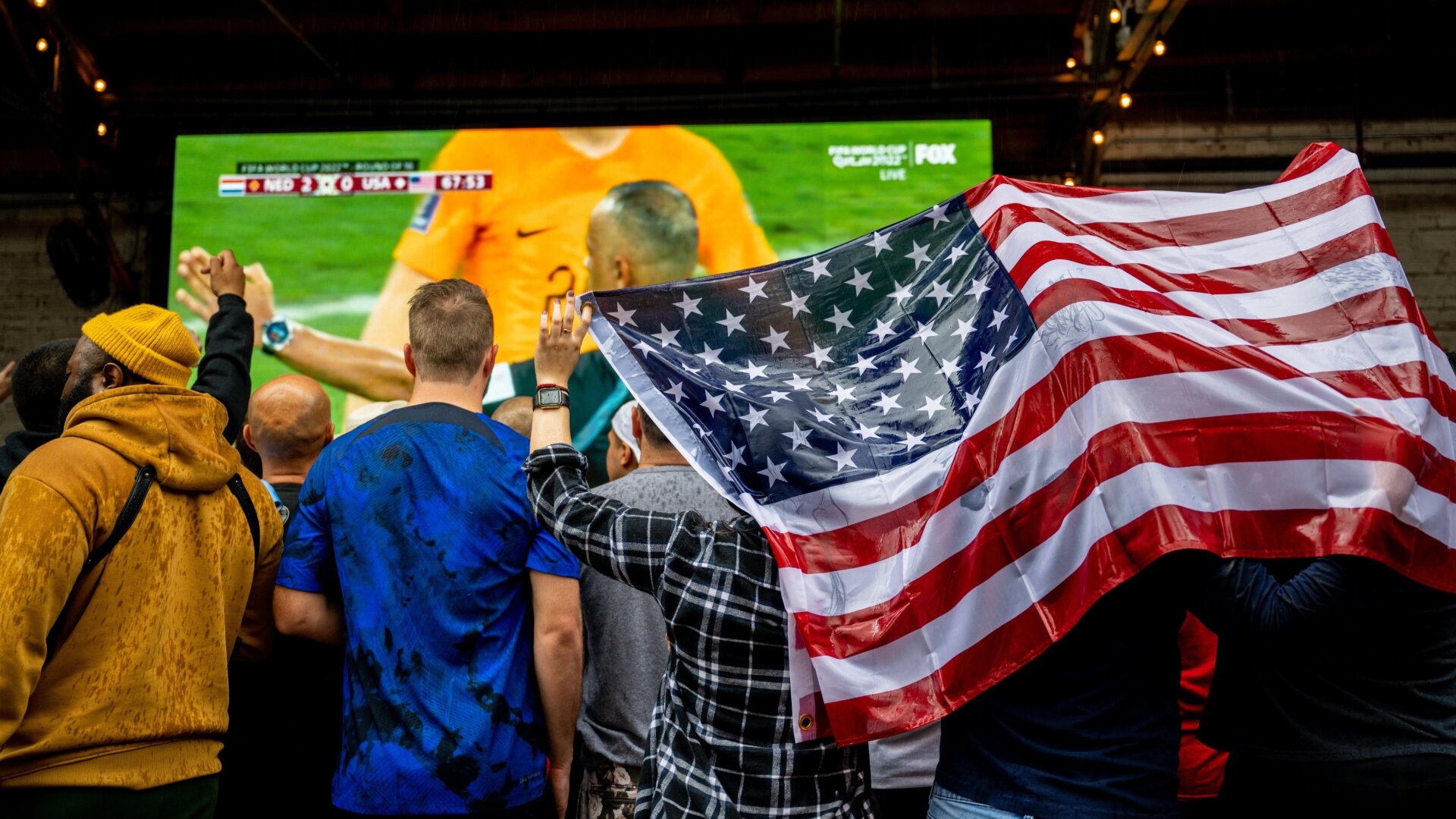 U.S. football fans watch the world cup in the U.S. team’s game against the Netherlands.