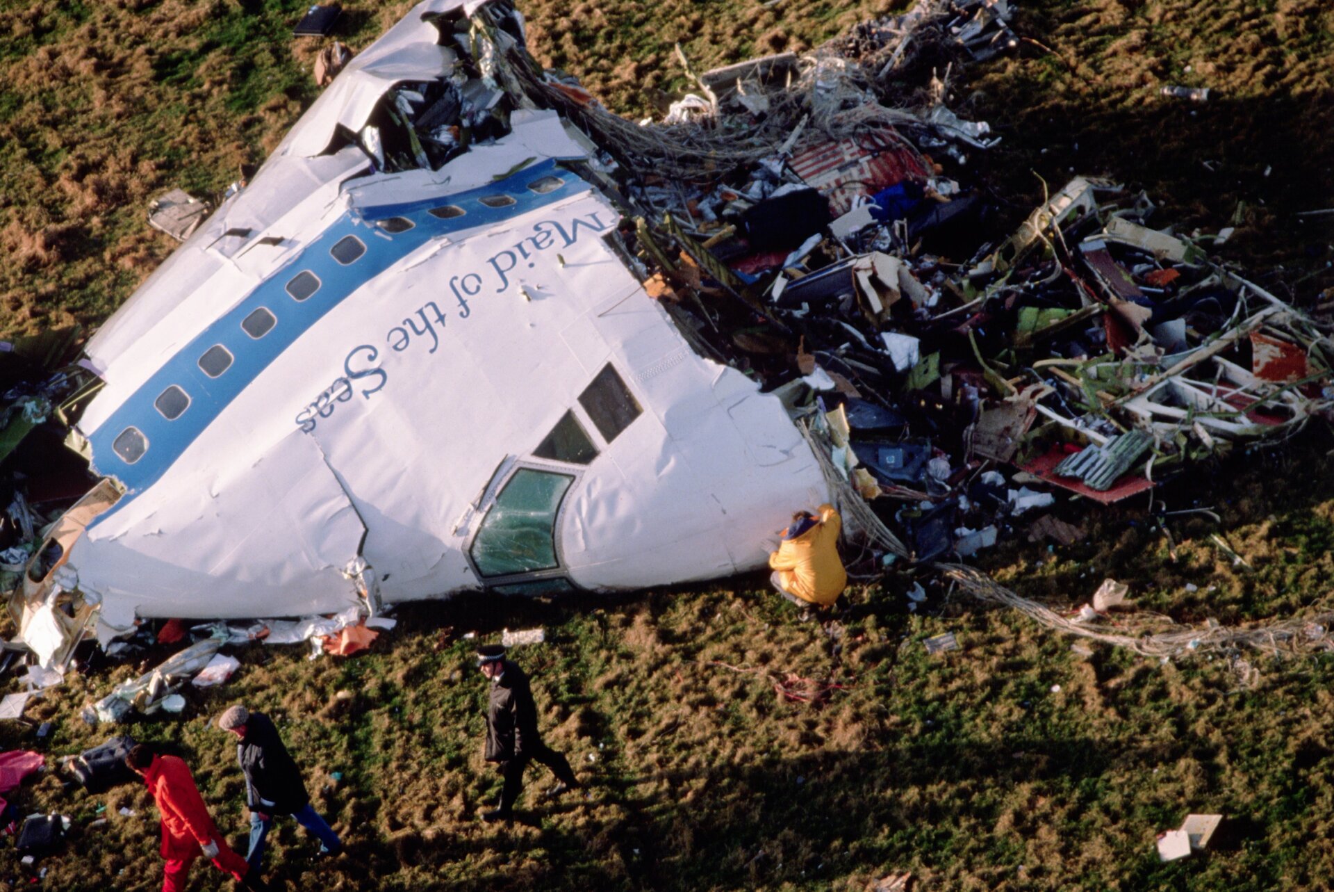 The cockpit section of ‘Clipper Maid of the Seas, Pan Ams flight 103 is inspected by police and specialists as it lay on the ground following a midair explosion over the village of Lockerbie, Dumfries and Galloway, United Kingdom, on Thursday, December 22, 1988