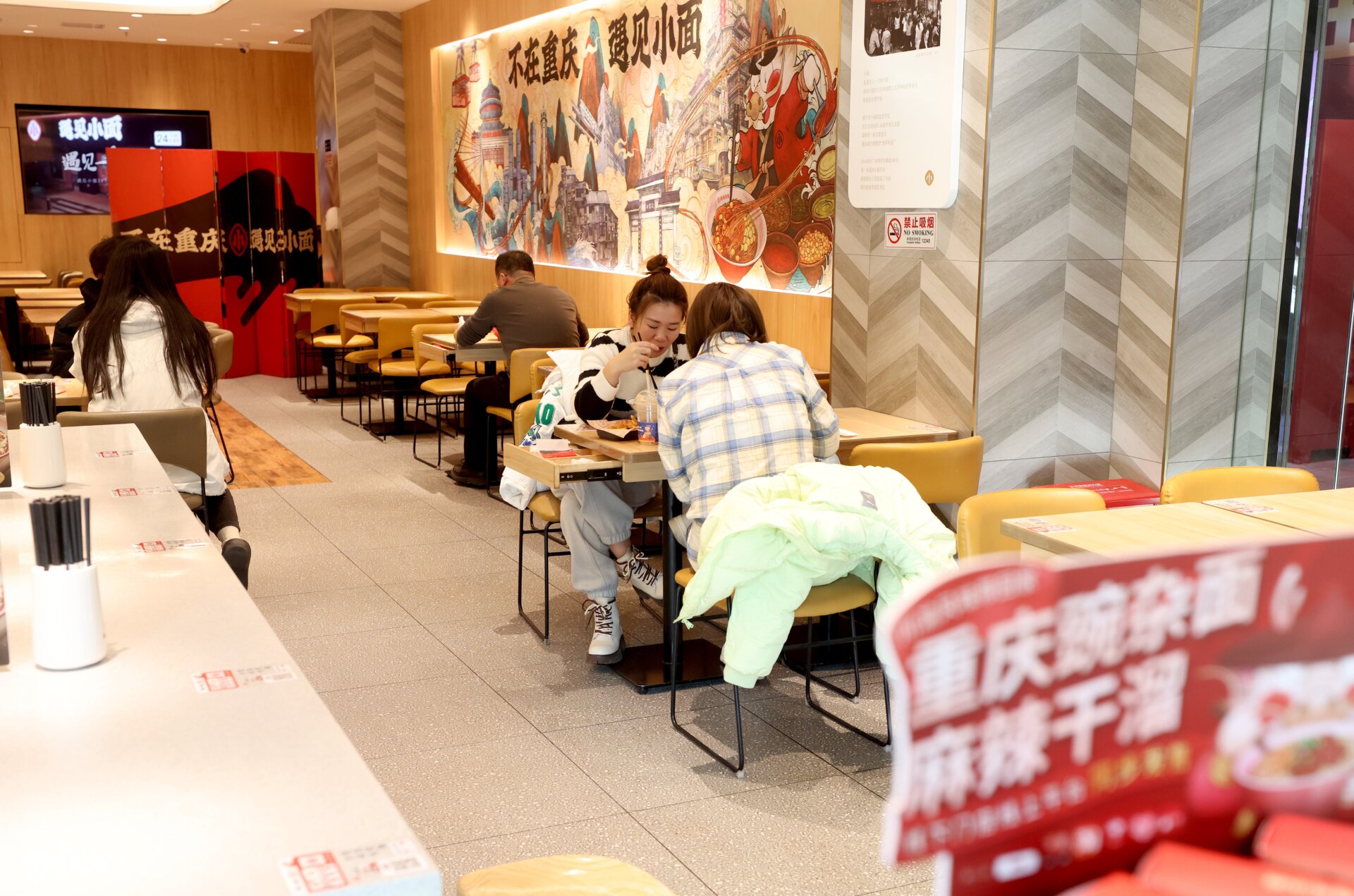 Customers dine at a restaurant as Beijing no longer requires people to  show their negative nucleic acid testing results before entering public  places on December 6, 2022 in Beijing, China.