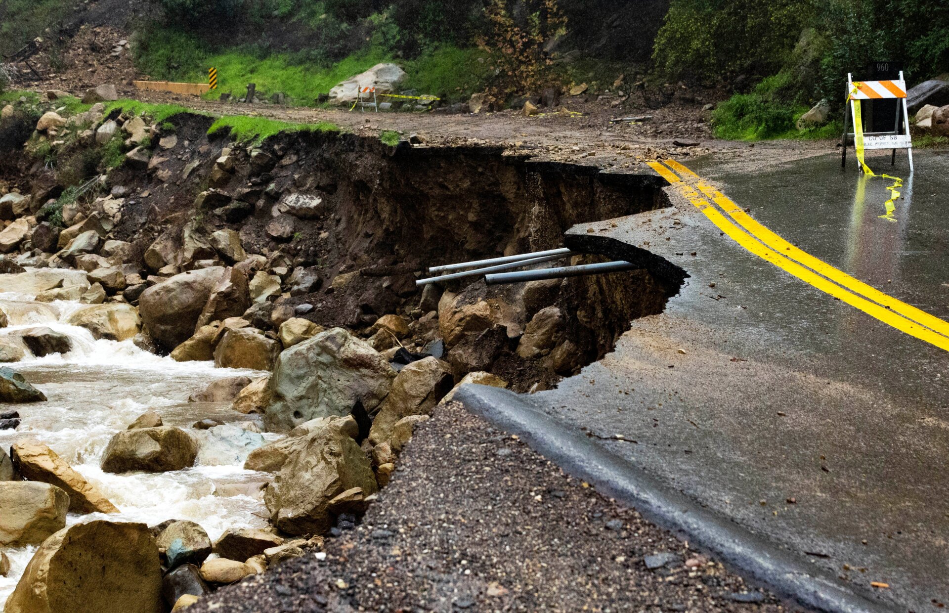 Montecito’s East Mountain Drive road collapsed due to earlier rain as fresh rain gathers below in Montecito Creek Saturday morning on January 15, 2023. 