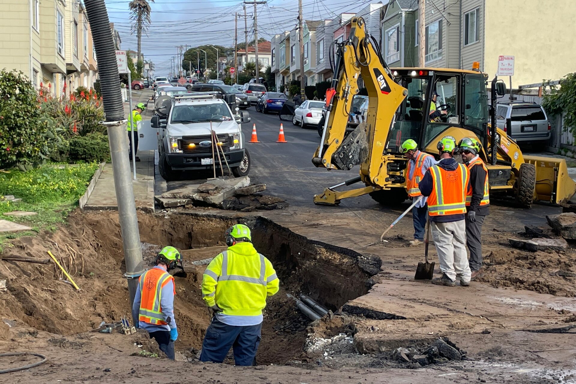 Flooding left behind other infrastructure damage, like this sinkhole in Daly City. 