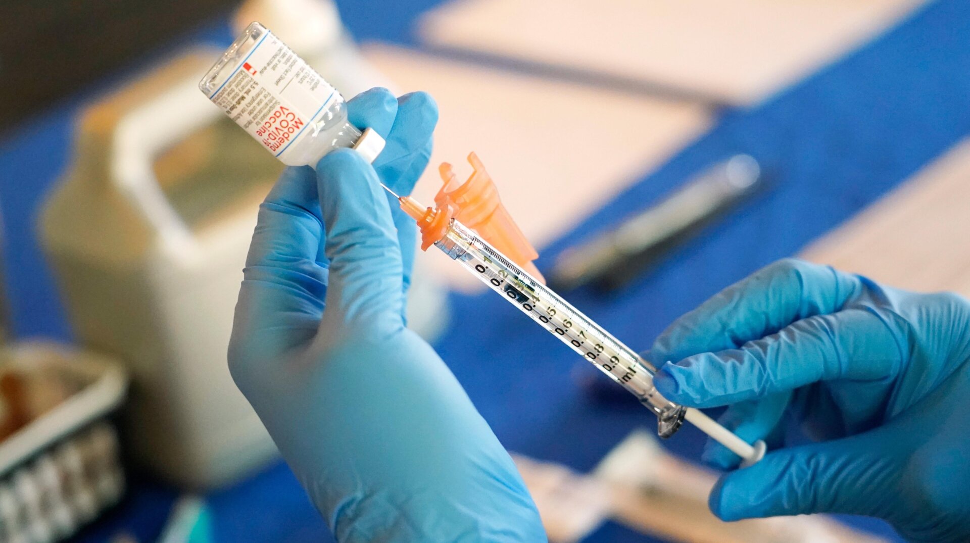 A nurse prepares a syringe of a Covid-19 vaccine in July 2022.