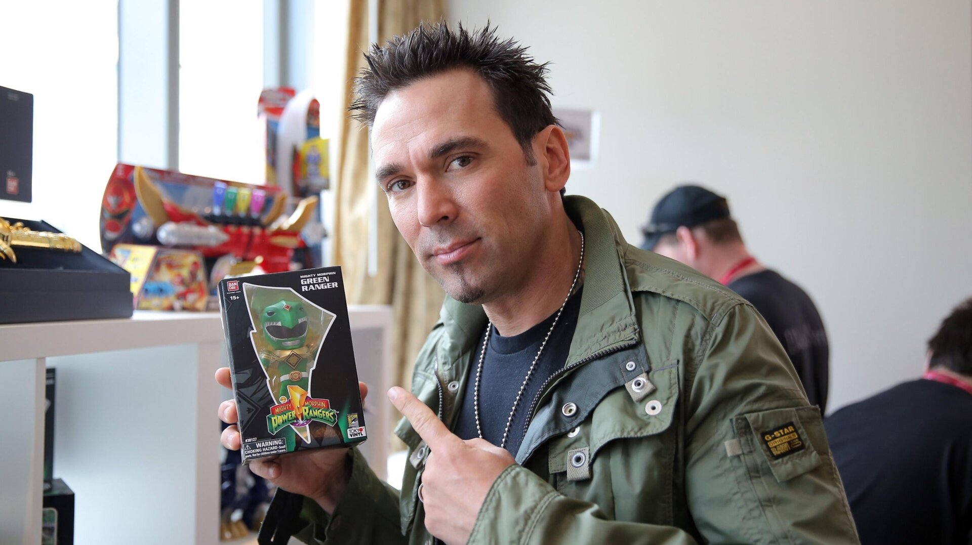 Jason David Frank checks out his Limited Edition Tokyo Vinyl Green Ranger at San Diego Comic-Con International on July 25, 2014 in San Diego, CA. 