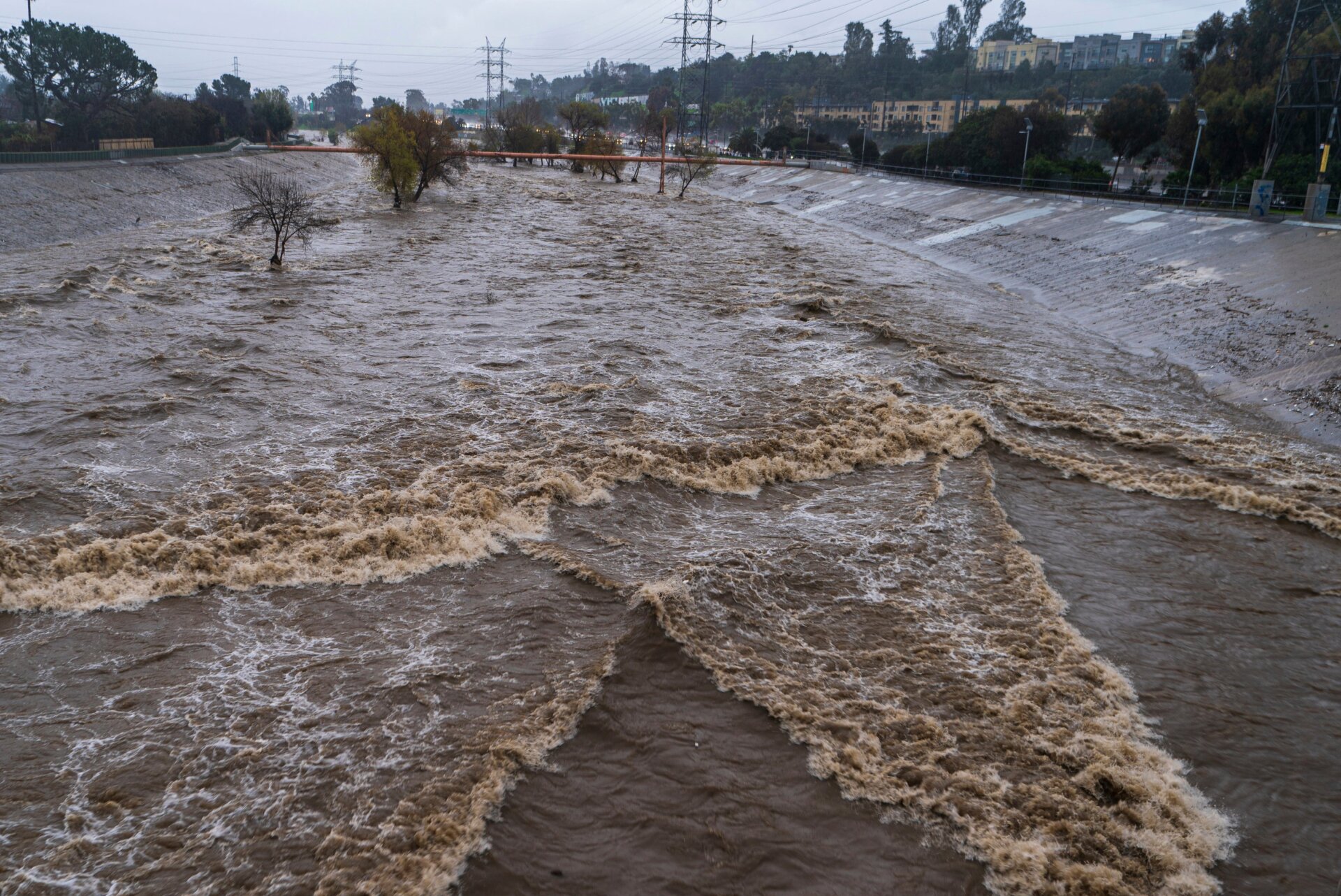 The Los Angeles River flows downstream in Los Angeles Saturday, January. 14, 2023.