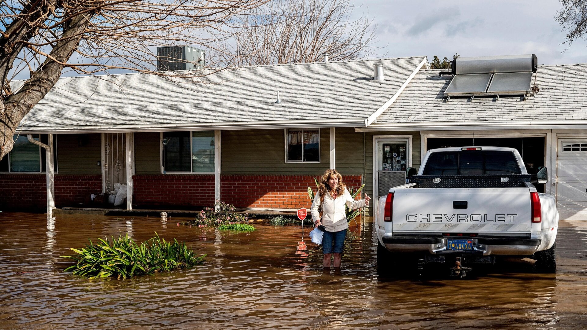 Kim Ochoa outside her flooded home in Merced, California on Tuesday, January 10.