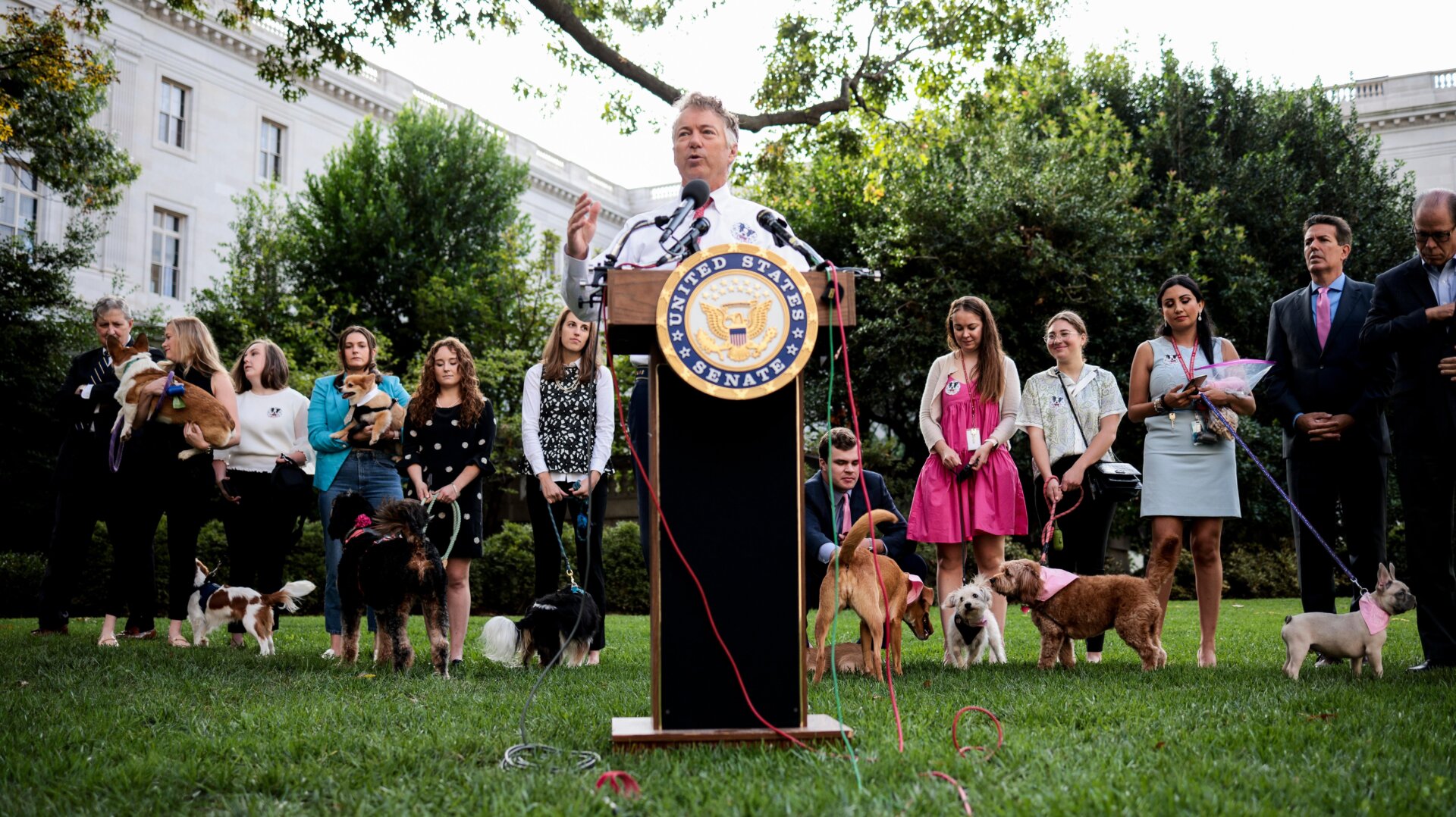 Senate staff members and their dogs look on as Sen. Rand Paul (R-KY) speaks at a press conference on his FDA Modernization Act on Capitol Hill on October 07, 2021 in Washington, DC.