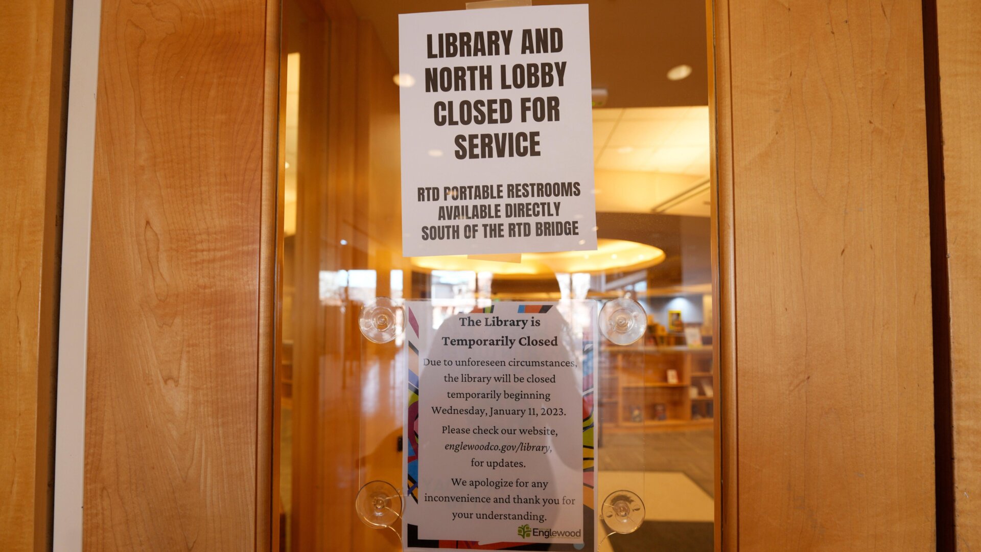 Signage on the Englewood library’s entrance indicate that the branch is temporarily closed—however the posted notices don’t reveal the reason why.