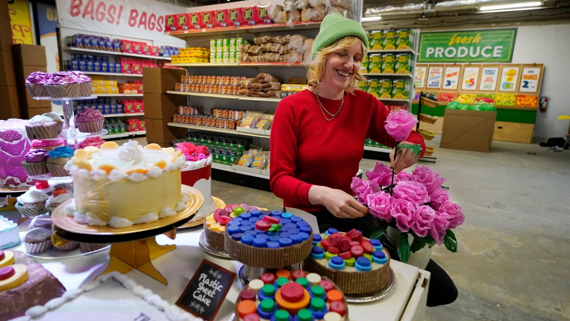 Robin Frohardt, creator of the Plastic Bag Store, inside the display.