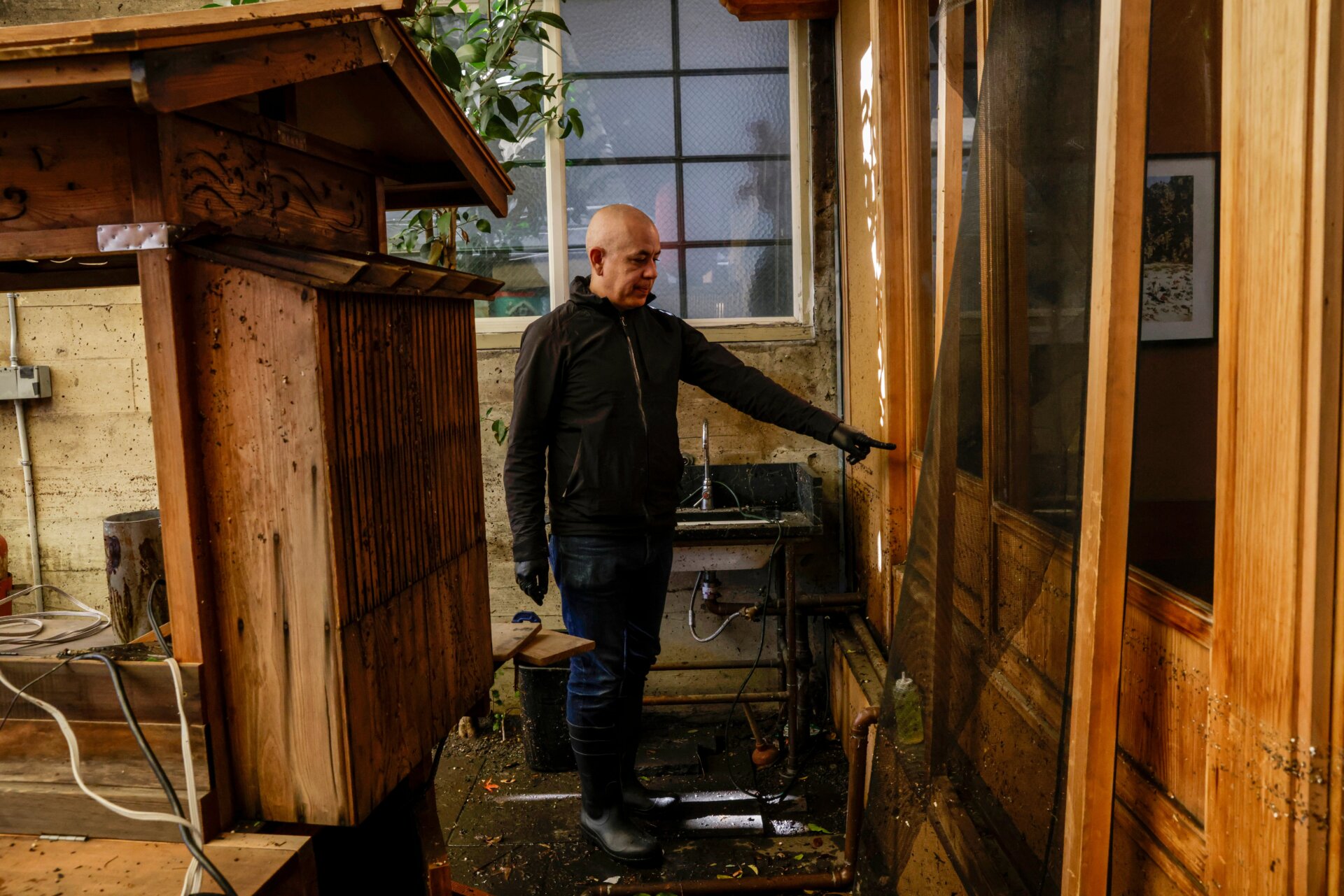 In the Bay Area, residents have begun clean-up efforts and preparation for another possible round of floods. Restaurant owner, Sylvan Mishima Brackett, points to the level flood waters rose to on January 1 in his San Francisco business. 