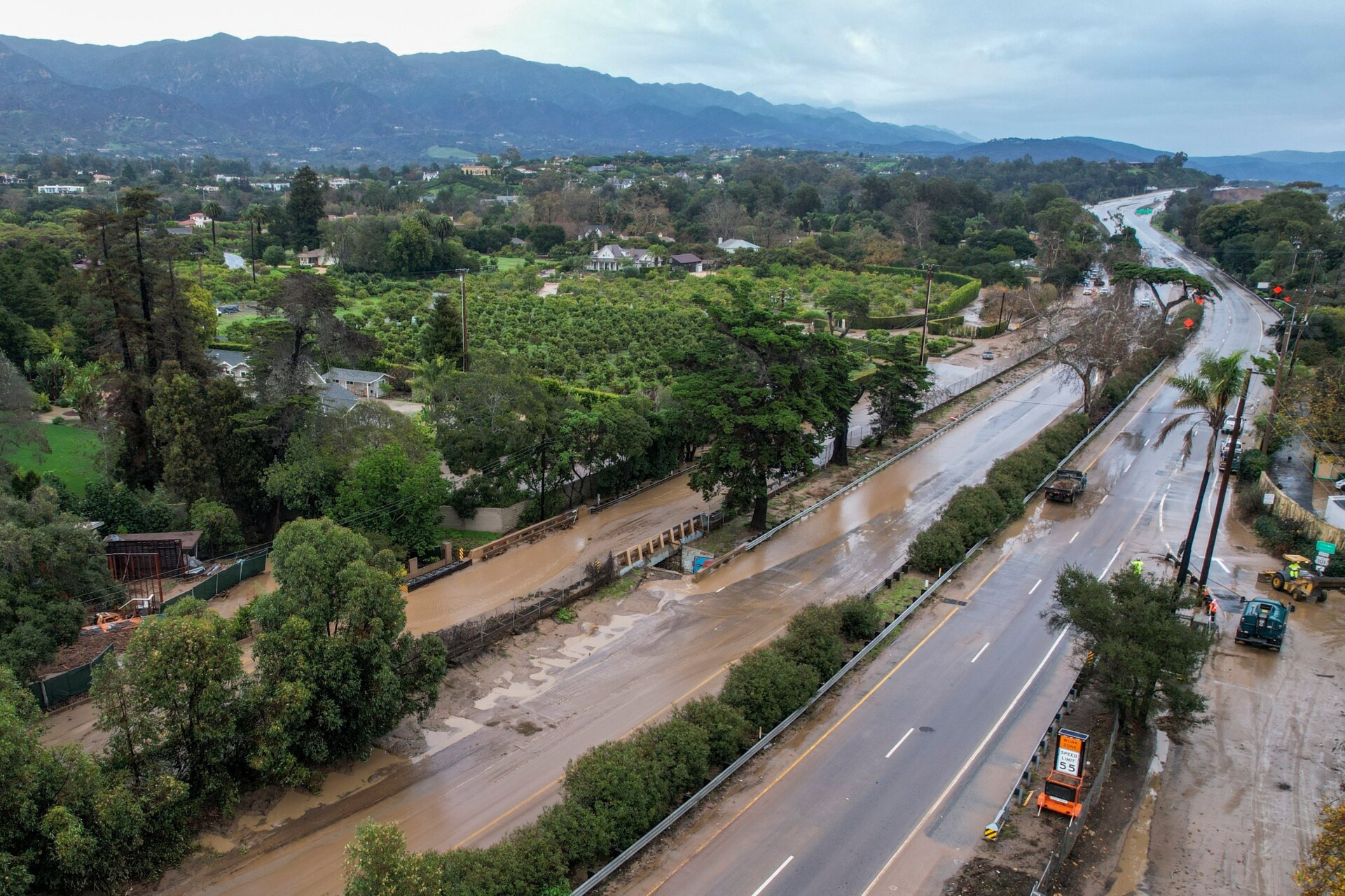 Water floods part of a road by the San Ysidro creek on Jameson Lane near the closed Highway 101 in Montecito, Calif., January. 10, 2023.