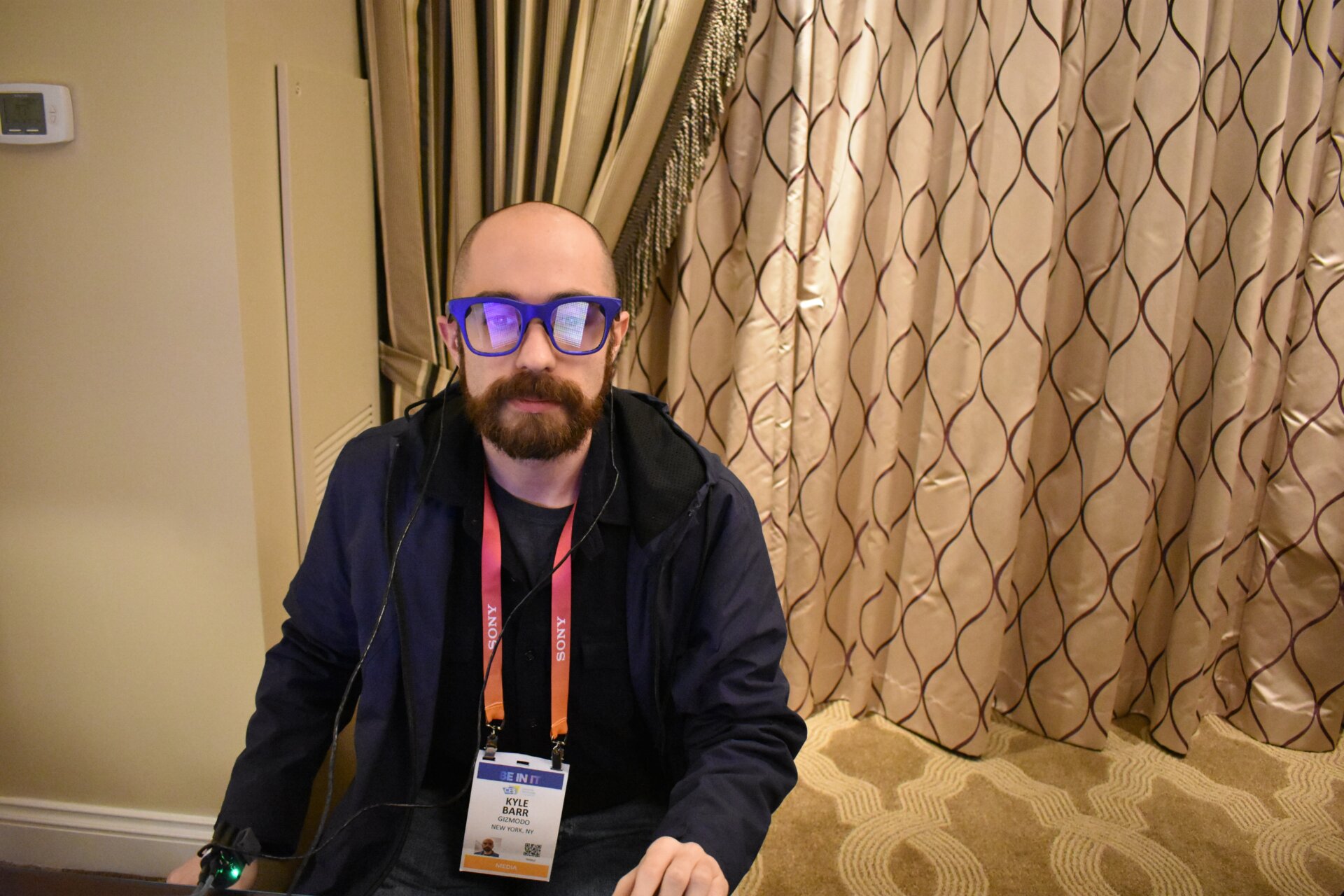 If I look awkward in this picture, its because I’m not staring at anything in the room but what’s going on behind the screens of Lumus’ prototype Z-Lens. The reflection is actually of the computer screen in front of me, and you can’t really see what I see behind the glasses. 