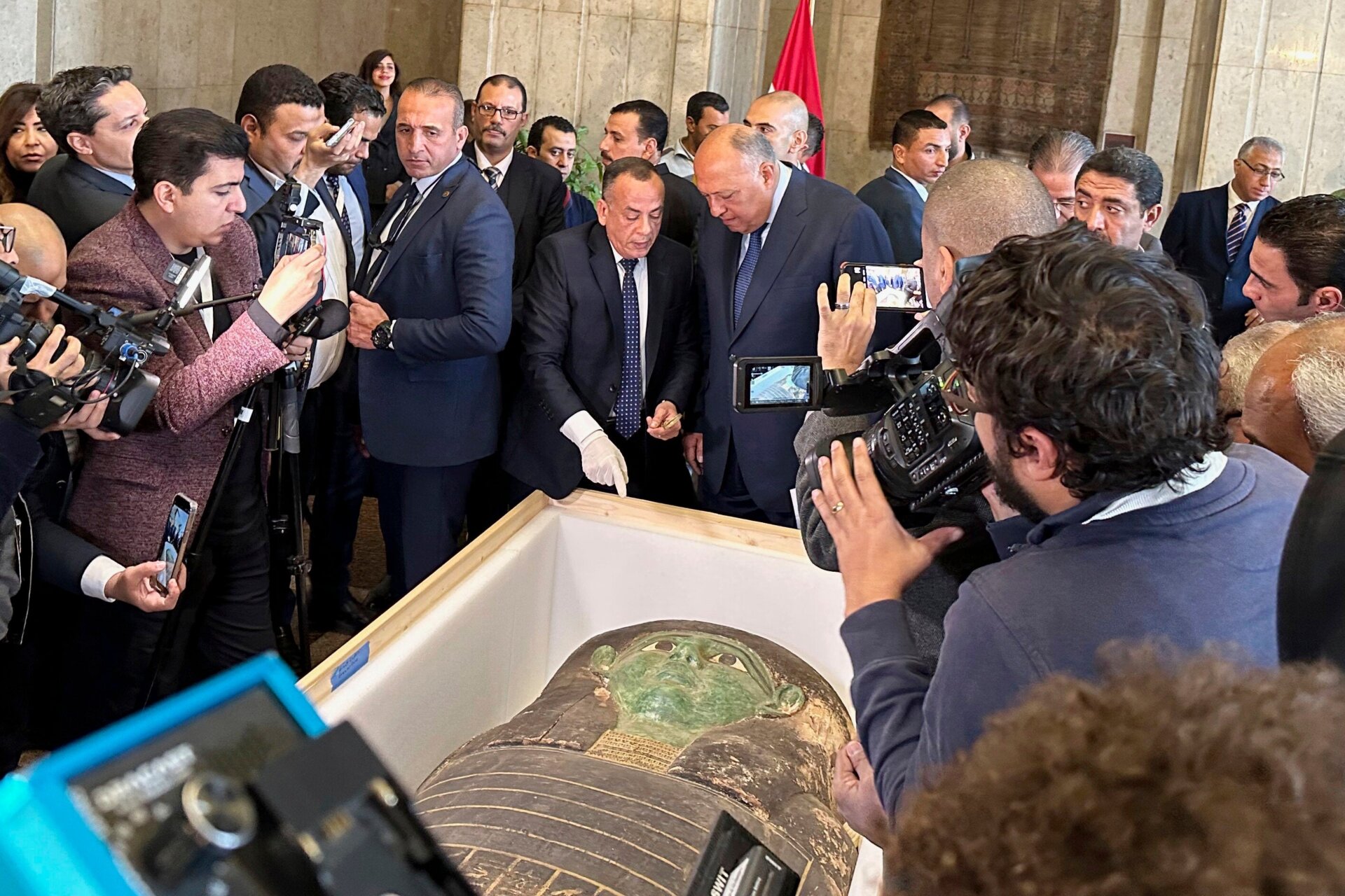 Egyptian officials with the repatriated sarcophagus.