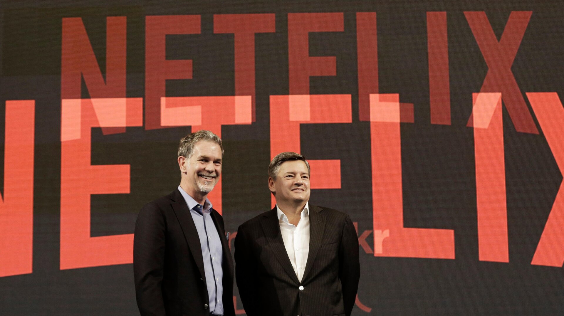 After about 25 years, Reed Hastings (left) has ceded his leadership role at Netflix to co-CEOs Ted Sarandos (left) and Greg Peters (not pictured).