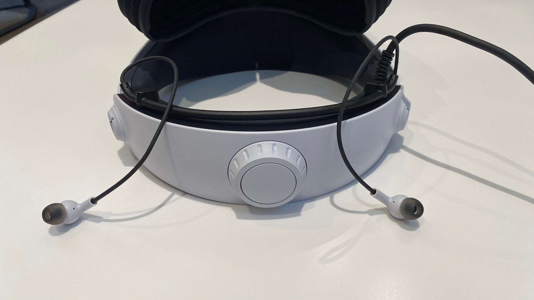 The PSVR 2's included earbuds attached to the headset