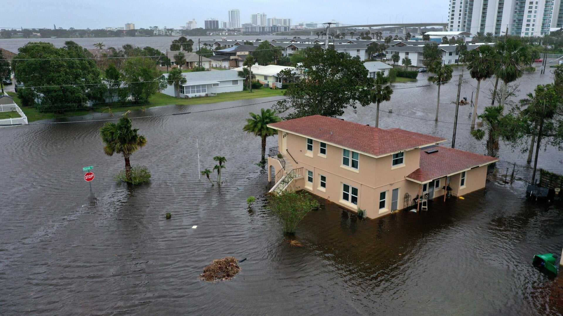 In this aerial view, flood water surrounds a building after Hurricane Nicole came ashore on November 10, 2022 in Daytona Beach, Florida.