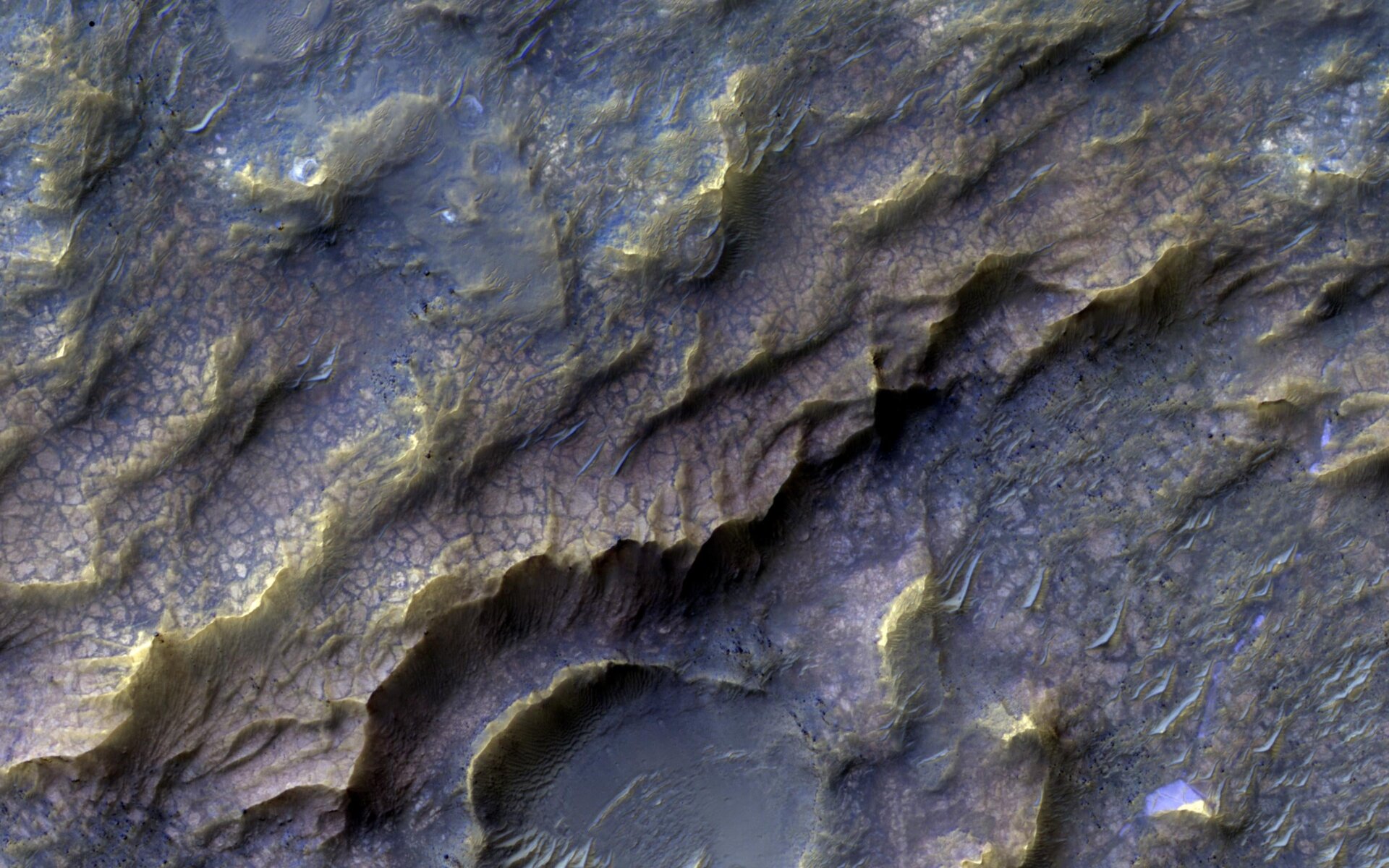 The ‘dragon scale’ pattern, seen here from the MRO, results from water interacting with rock.