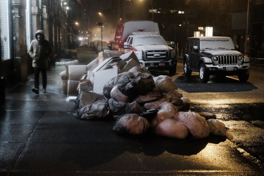People walk along a street during a storm on February 27, 2023 in New York City.