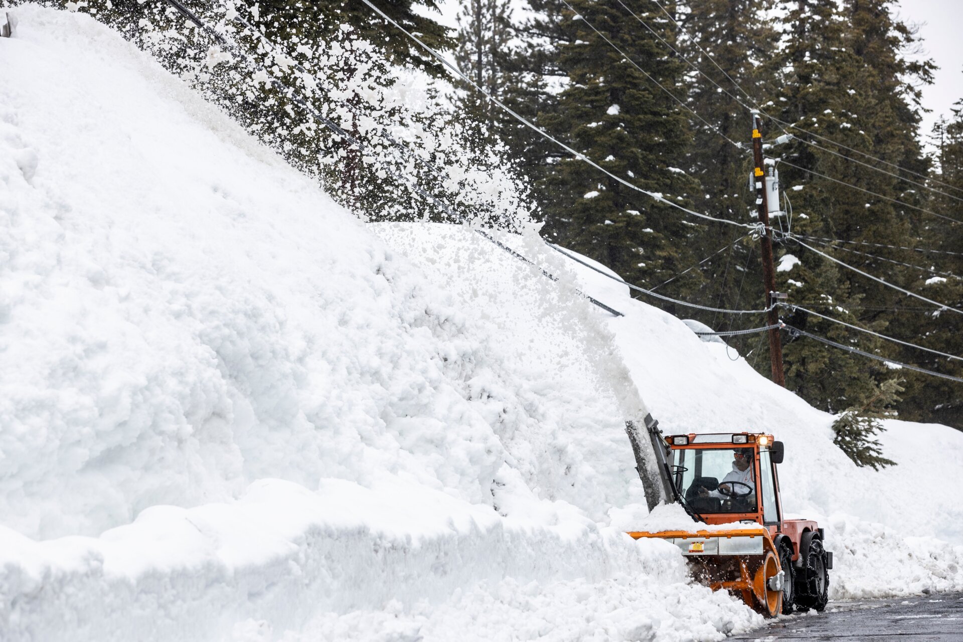 A snowblower works to clear a road in Tahoe City, California on March 14. 