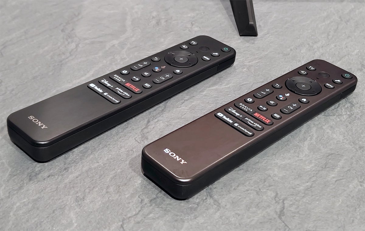 The two remotes of the 2023 TV Lineup. You will have to turn the lights off to guess which is which.