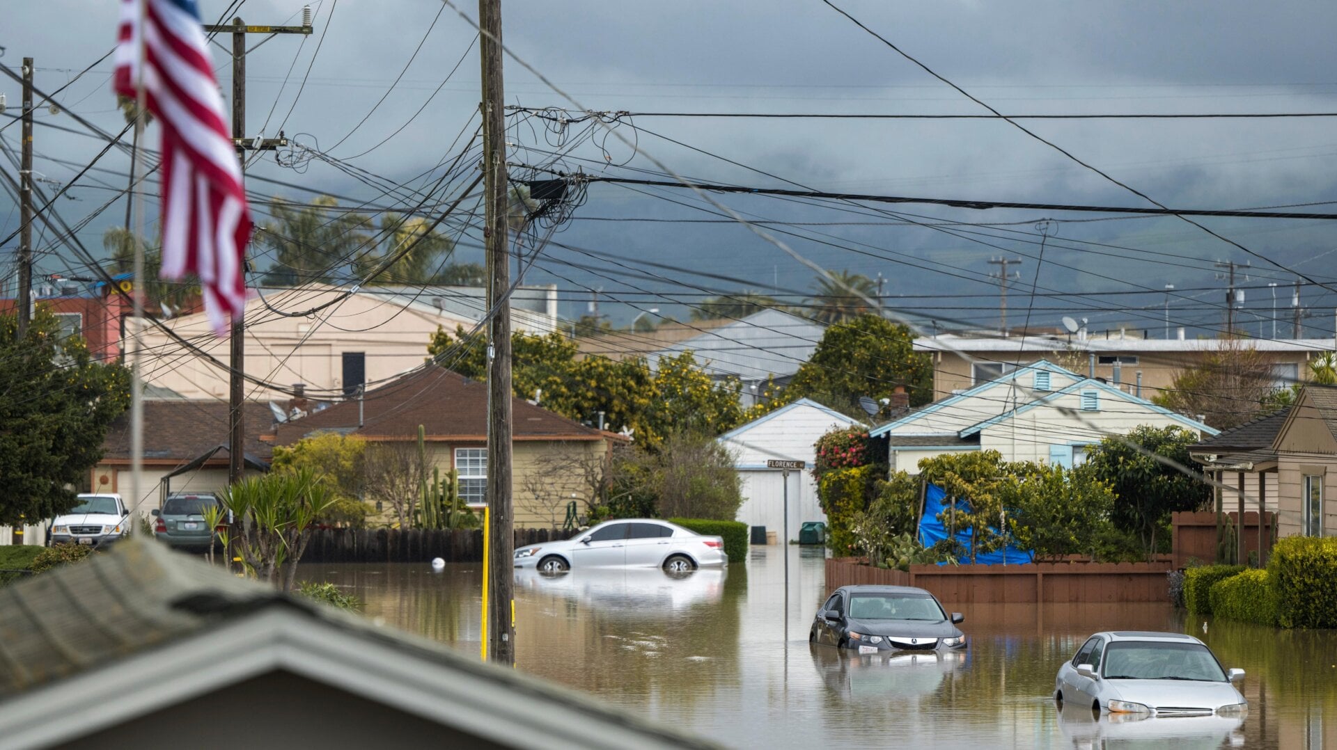 Cars sit partially submerged in floodwaters in Watsonville, Calif., Saturday, March 11, 2023.