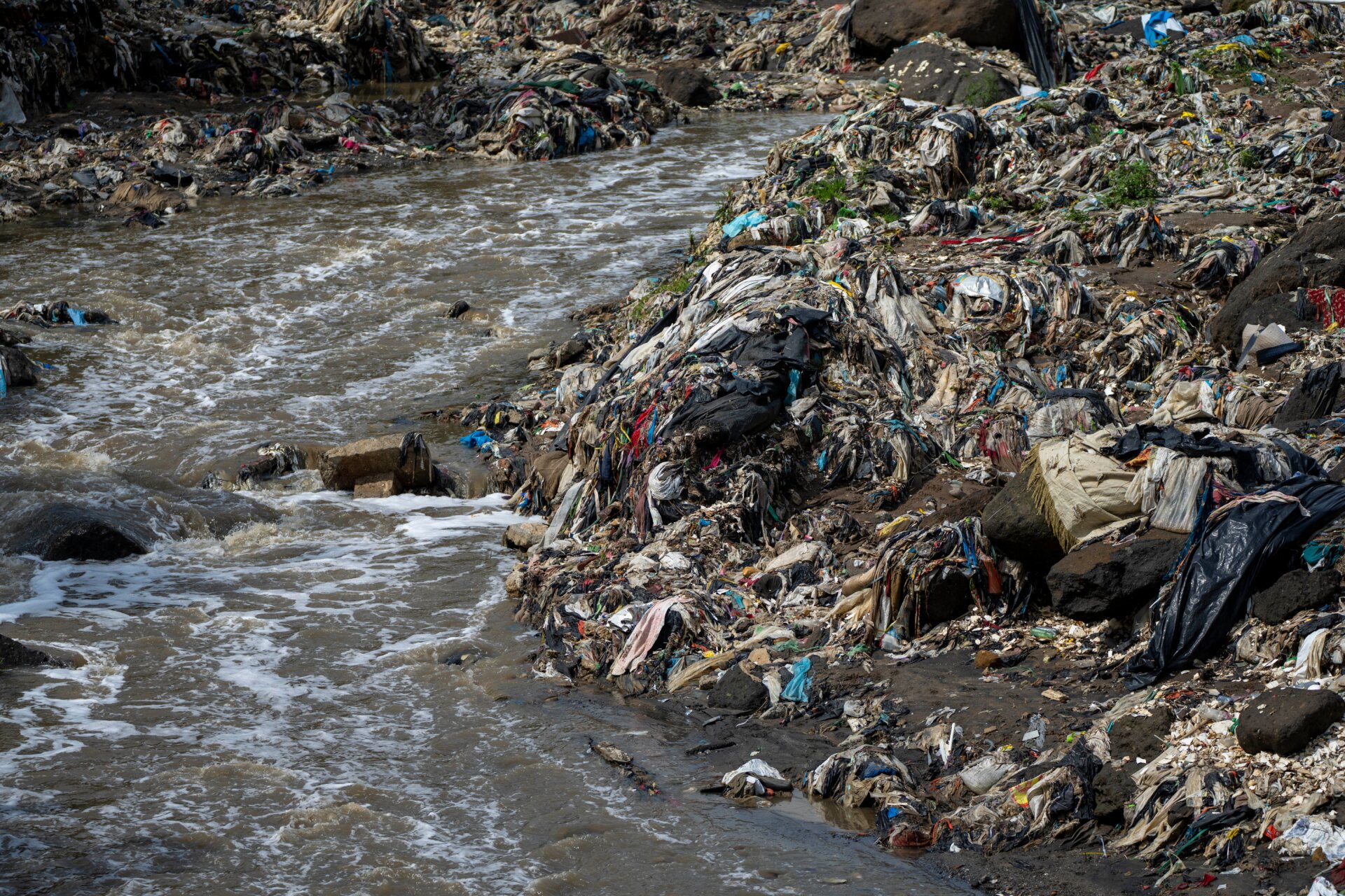 Trash in a river on the outskirts of Guatemala City. Plastic that ends up in the ocean often starts by being dumped inland, where rivers feed it into the sea. 