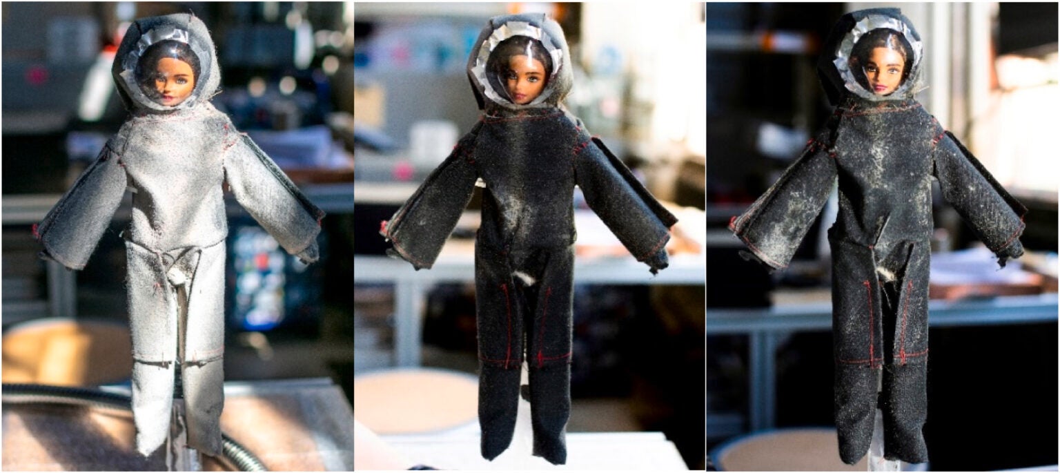 A Barbie doll stands in for a lunar astronaut and is covered in simulated Moon dust before cleaning (left), the doll after sweeping motions with the spray (middle) and after spot treatments (right). 