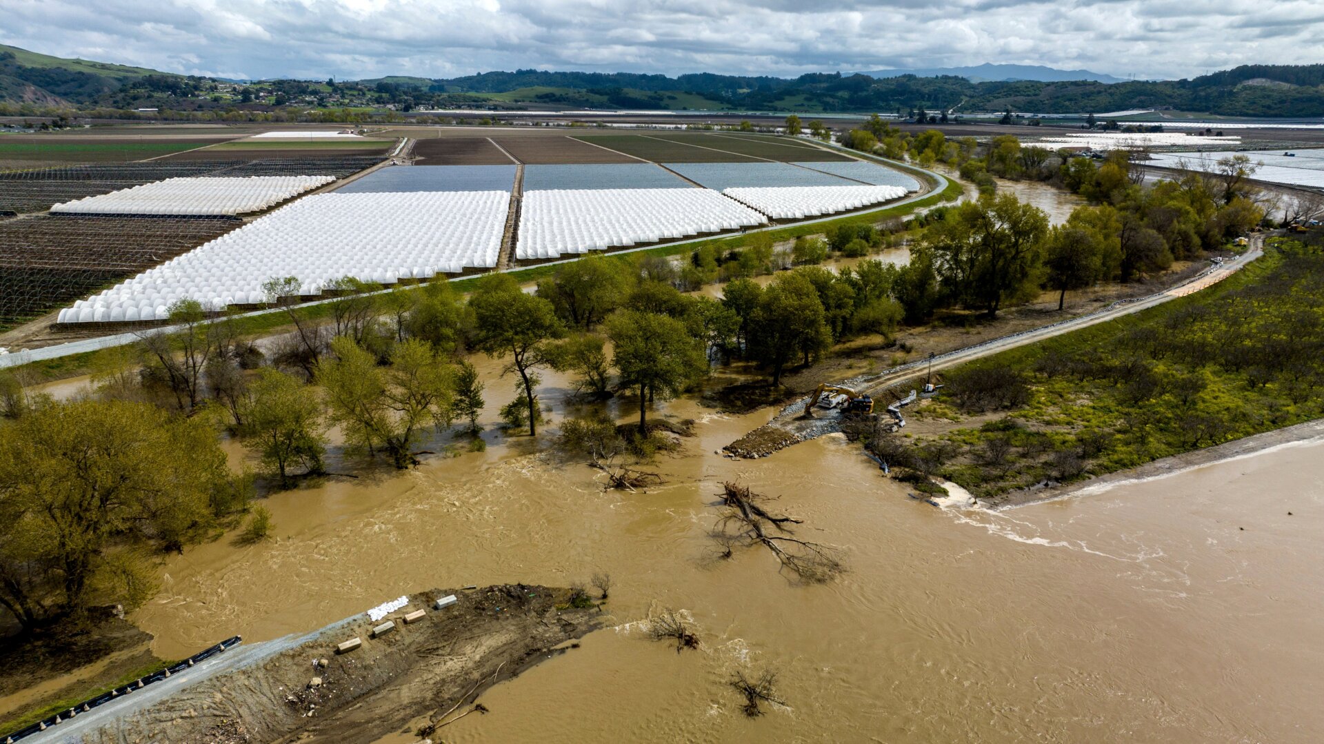 Water flows through the levee breach near the Aromas community in Monterey County, California on March 13. 