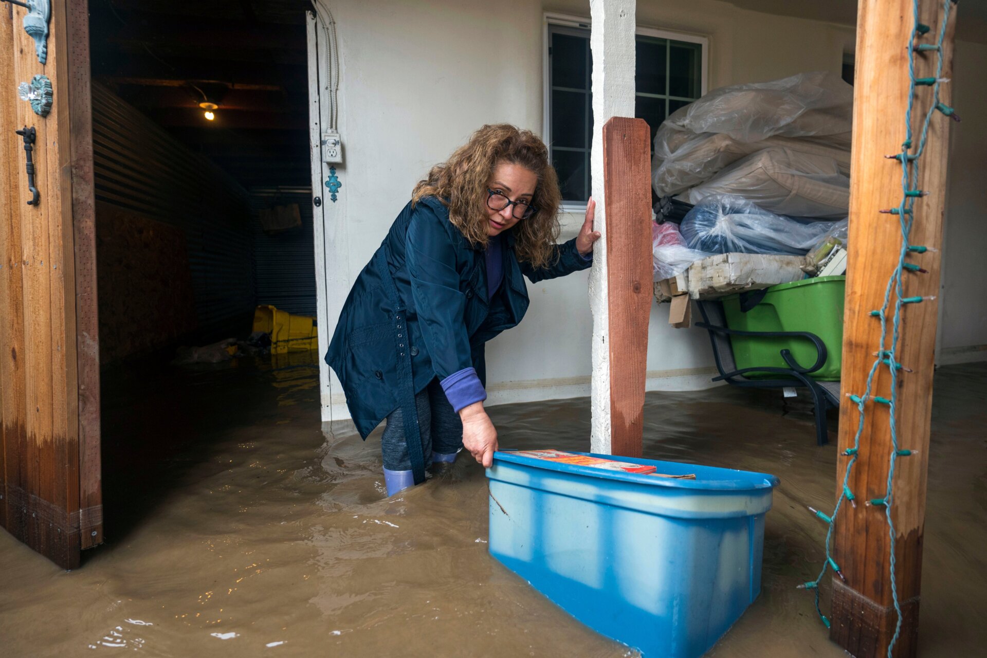 Nearby Pajaro, the city of Watsonville also flooded. Teresa Fuentes moves her belongings out of her flooded home in Watsonville, California on March 10. 